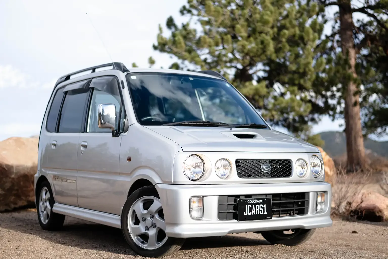 front drivers angle view of silver daihatsu move custom aero down xx turbo usa legal jdm vehicle with title for sale colorado USA