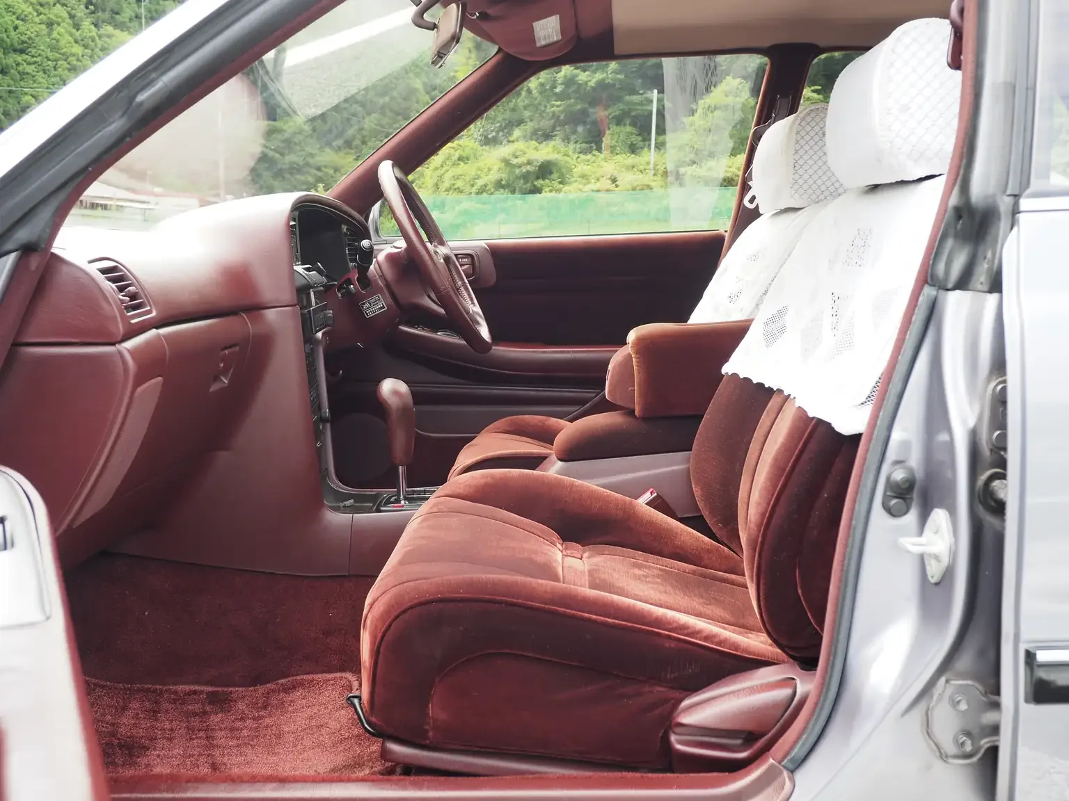 front passengers seat interior view looking in from open door the seat has lace half seat covers view grey 1990 toyota chaser gx81 jdm export stock japan