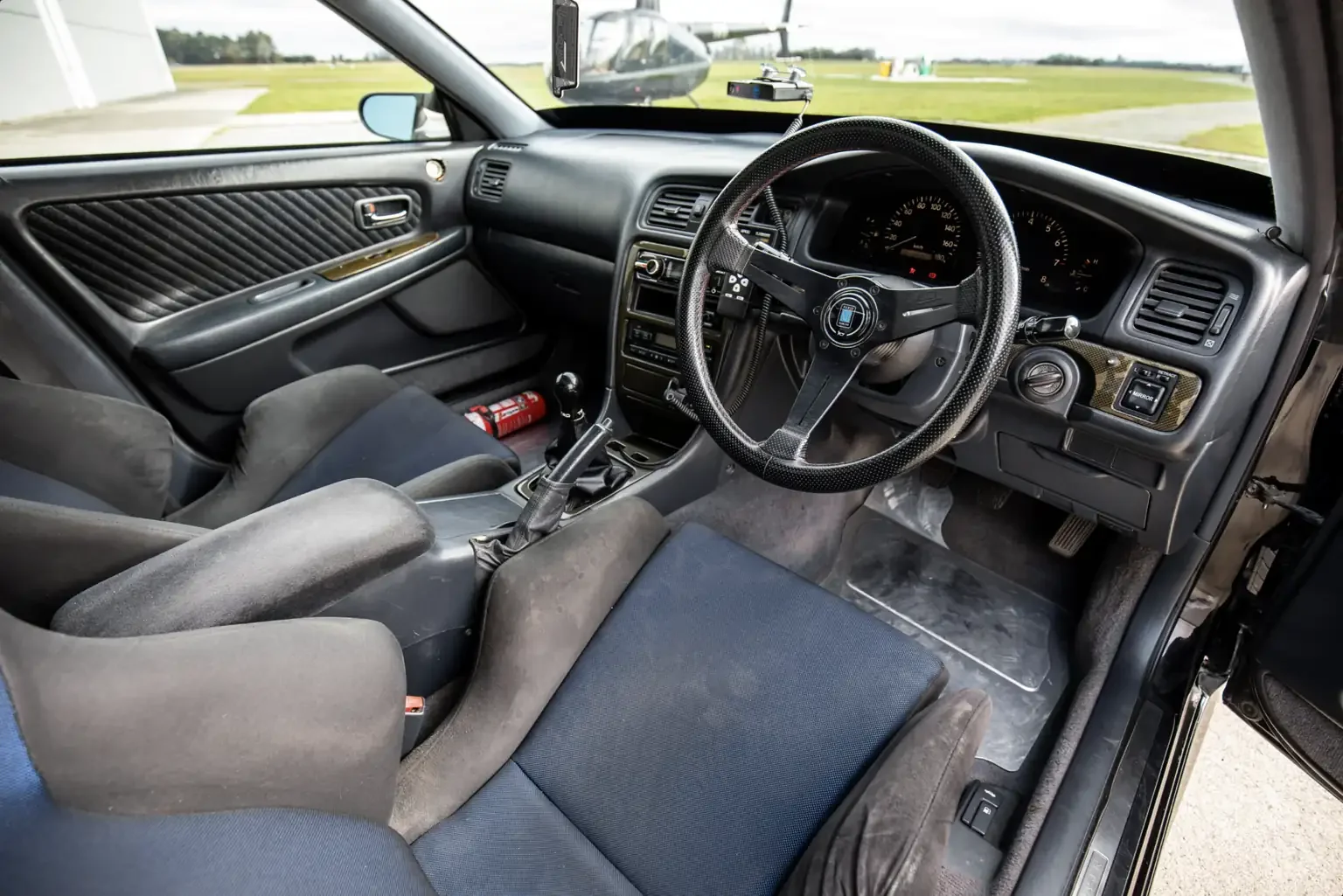 drivers side front interior view black toyota chaser tourer v jzx100 custom steel wide body jdm export vehicle new zealand