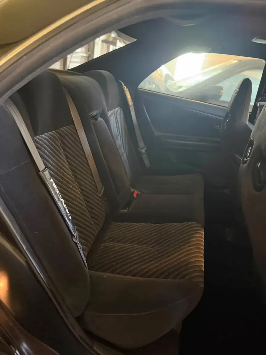rear seat view black toyota chaser tourer v jzx100 custom steel wide body jdm export vehicle new zealand
