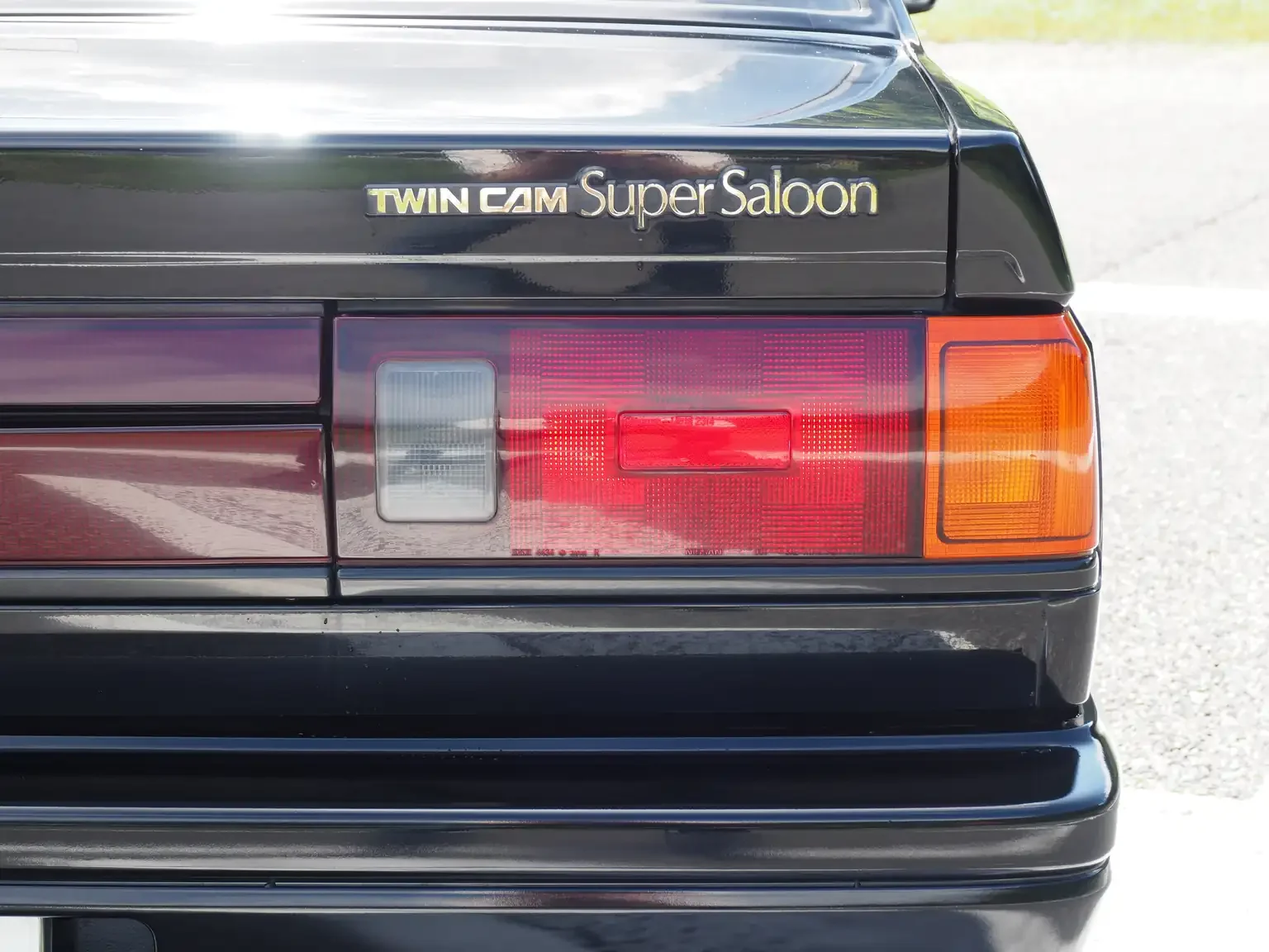 twin cam super saloon emblem view of 1989 Nissan sunny super saloon twin cam NISMO in black jdm export vehicle Japan