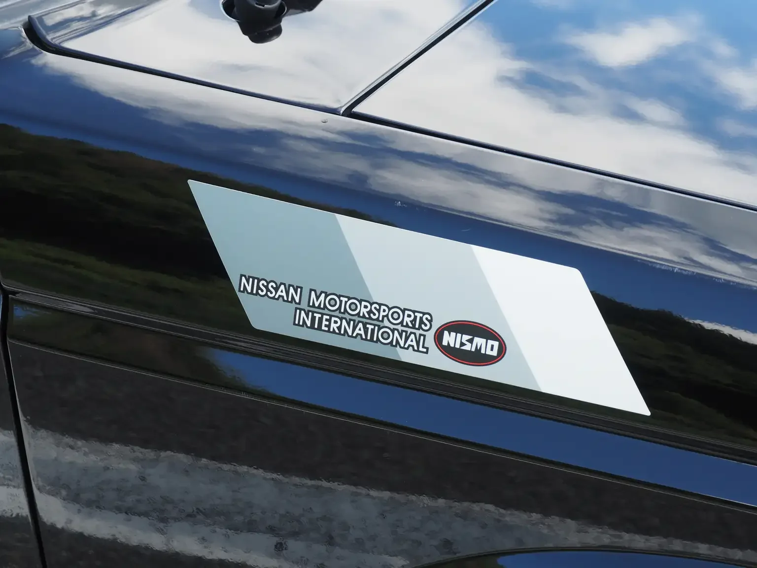 Nismo fender sticker view of 1989 Nissan sunny super saloon twin cam NISMO in black jdm export vehicle Japan