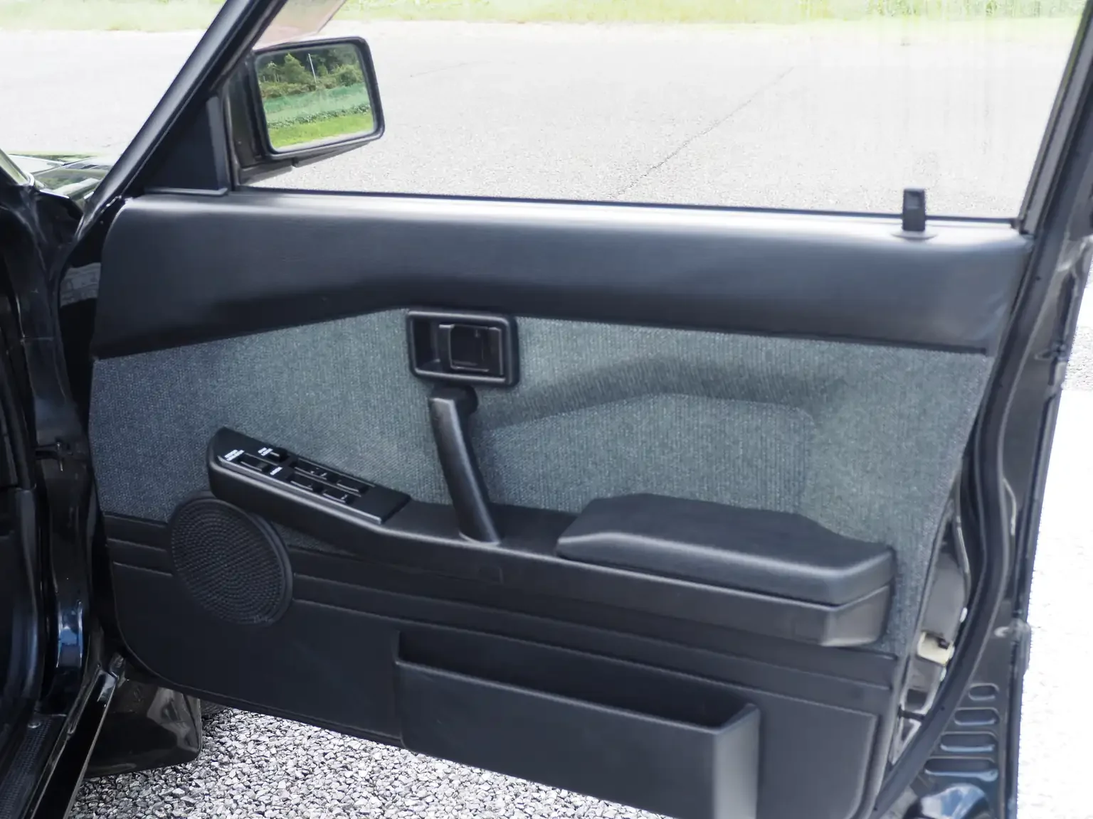 nismo drivers door card view of 1989 Nissan sunny super saloon twin cam NISMO in black jdm export vehicle Japan