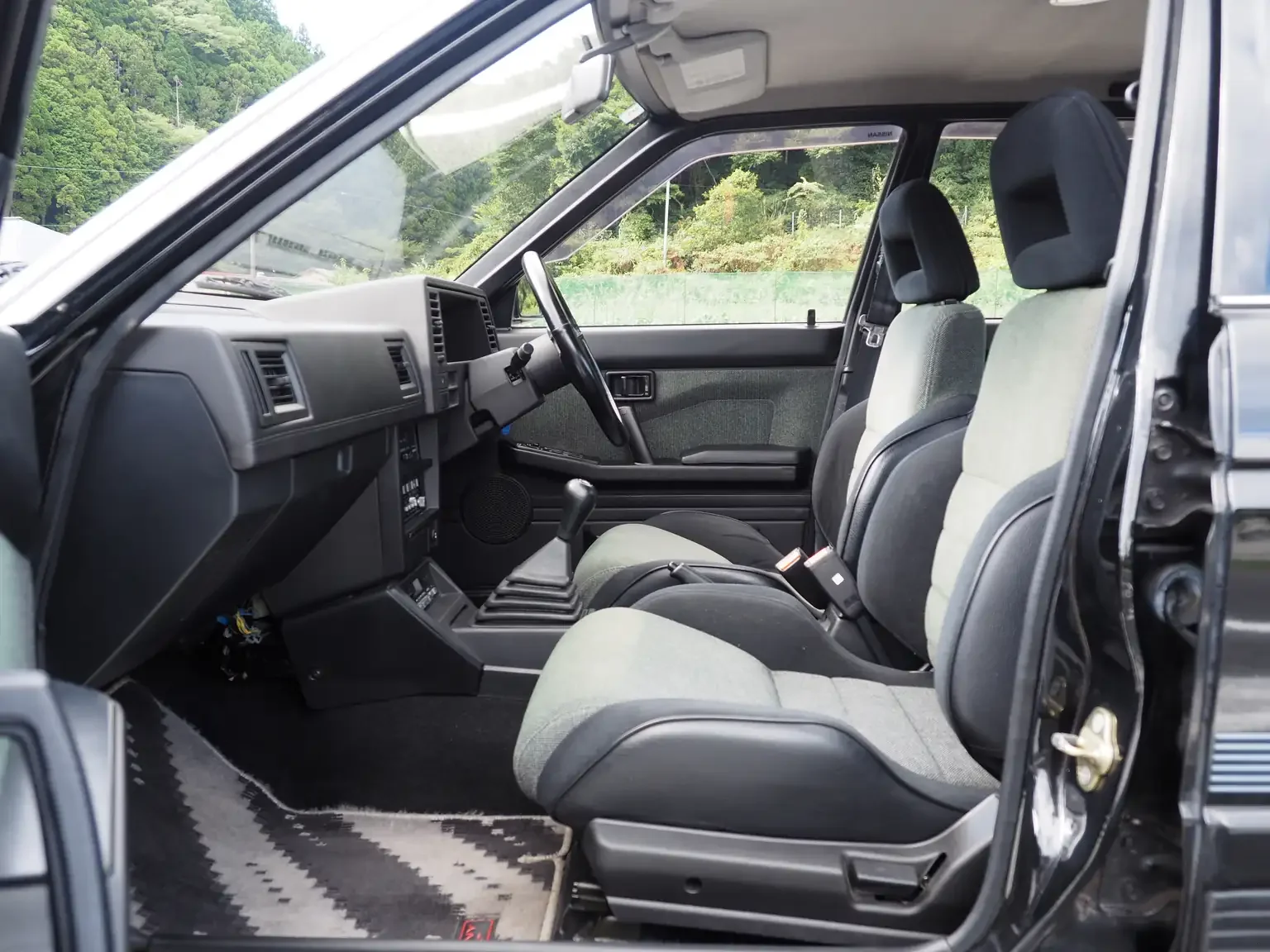 nismo front interior view of 1989 Nissan sunny super saloon twin cam NISMO in black jdm export vehicle Japan