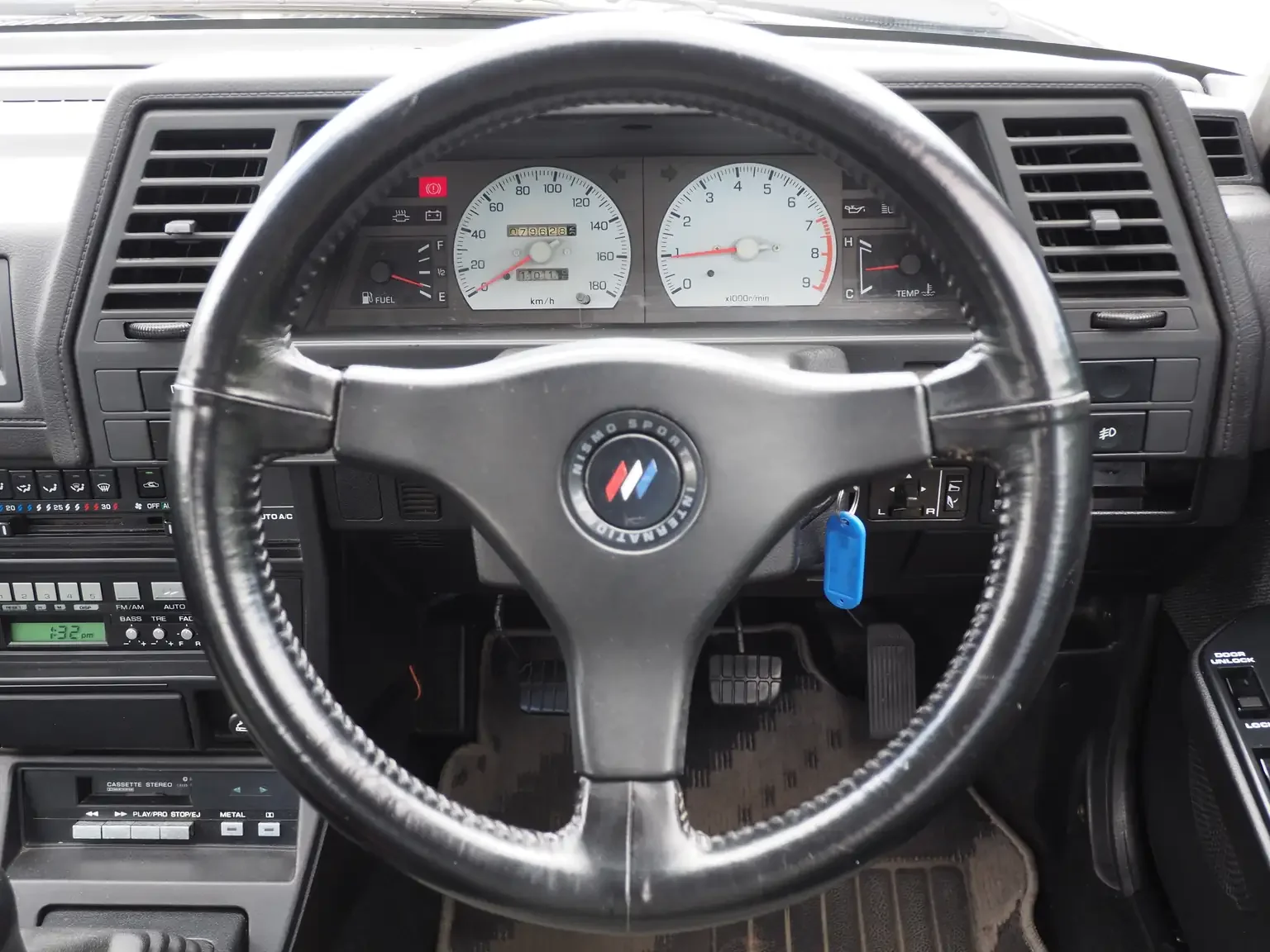 Nismo leather wrapped steering wheel view of 1989 Nissan sunny super saloon twin cam NISMO in black jdm export vehicle Japan