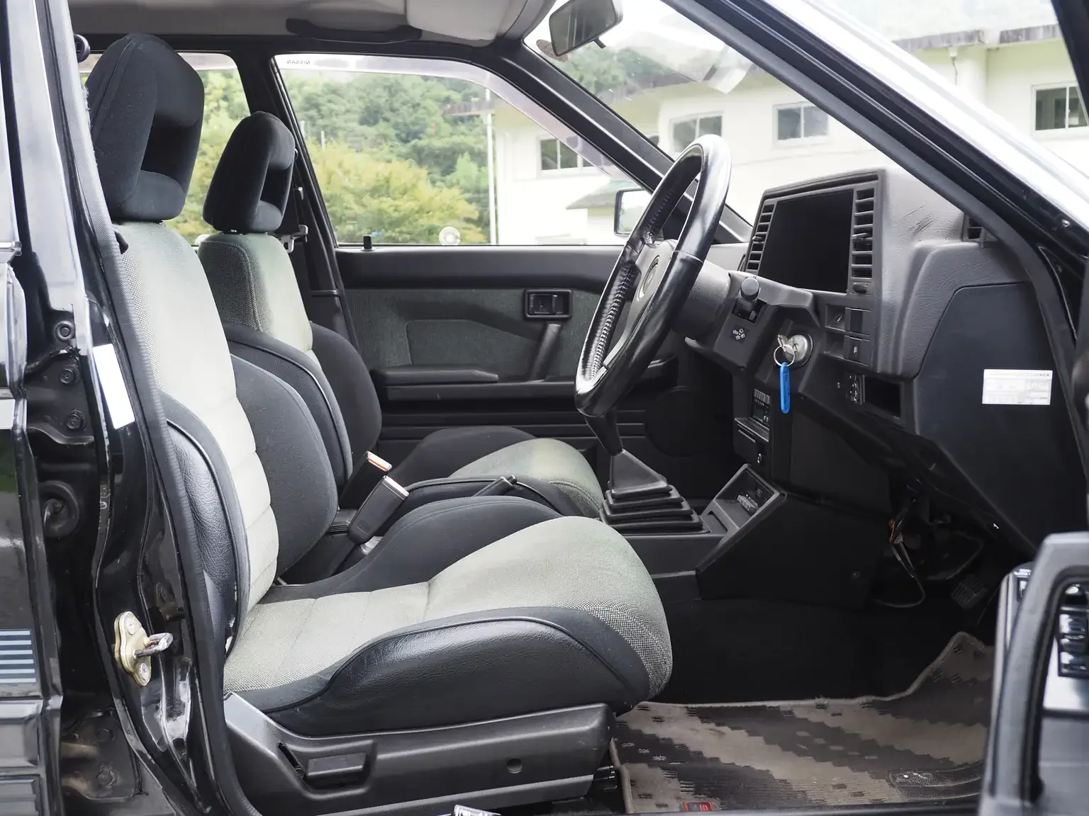 nismo front interior view of 1989 Nissan sunny super saloon twin cam NISMO in black jdm export vehicle Japan