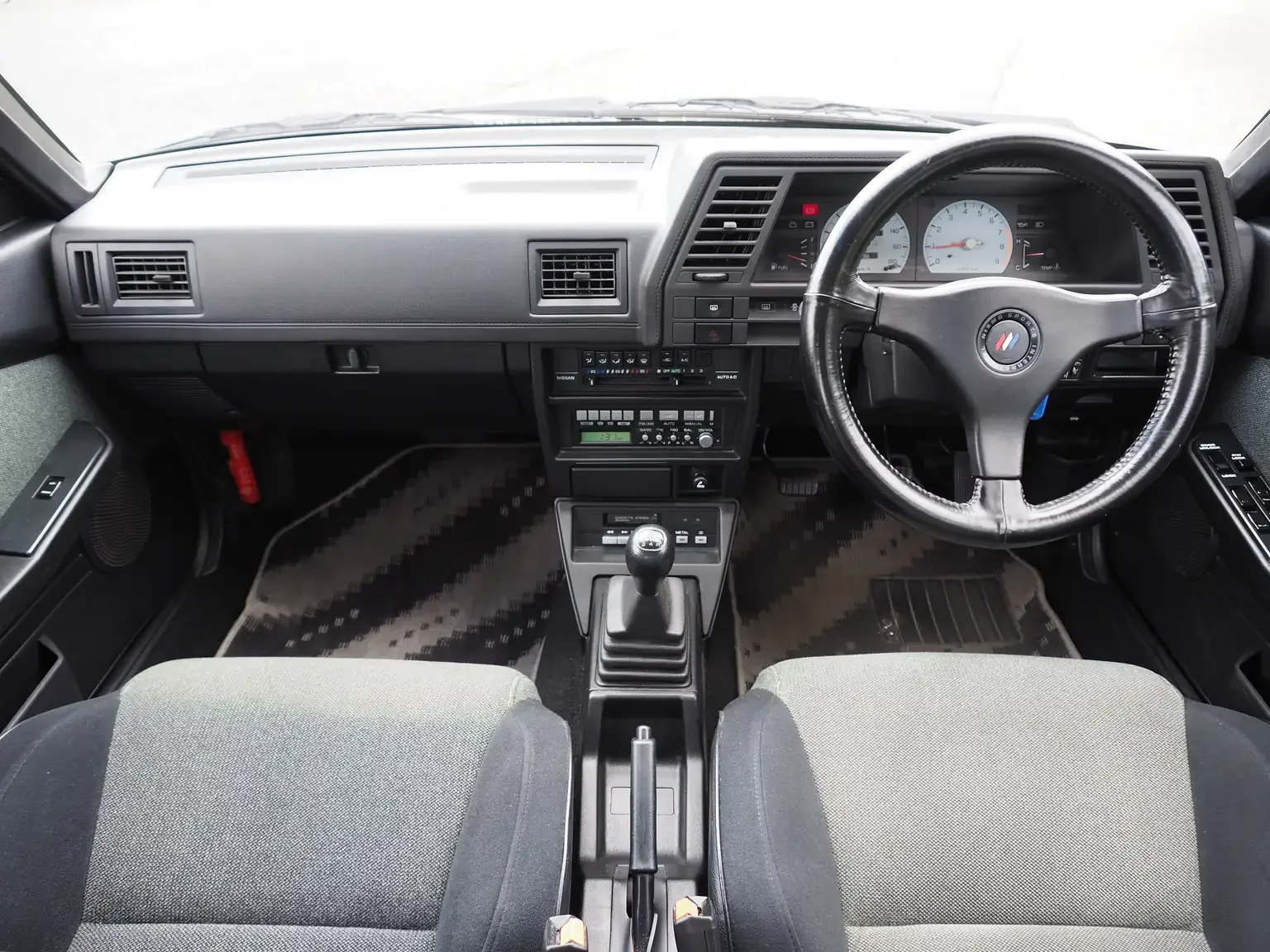 nismo front interior view of 1989 Nissan sunny super saloon twin cam NISMO in black jdm export vehicle Japan