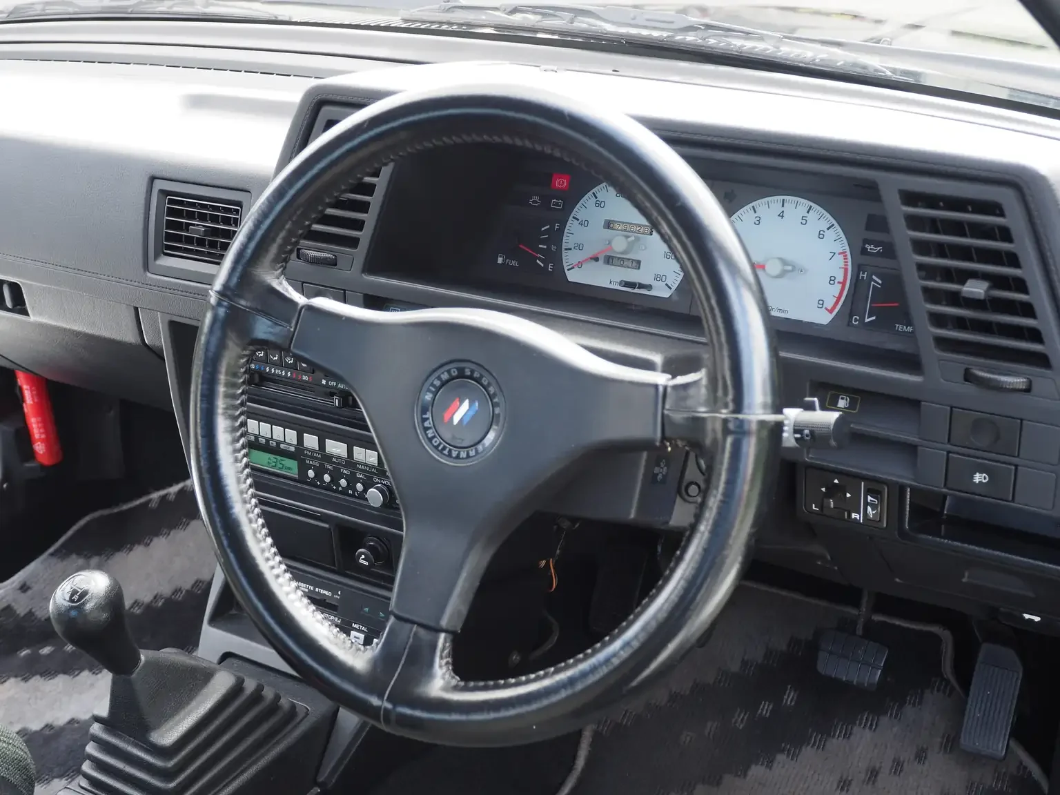 nismo sports steering wheel view of 1989 Nissan sunny super saloon twin cam NISMO in black jdm export vehicle Japan