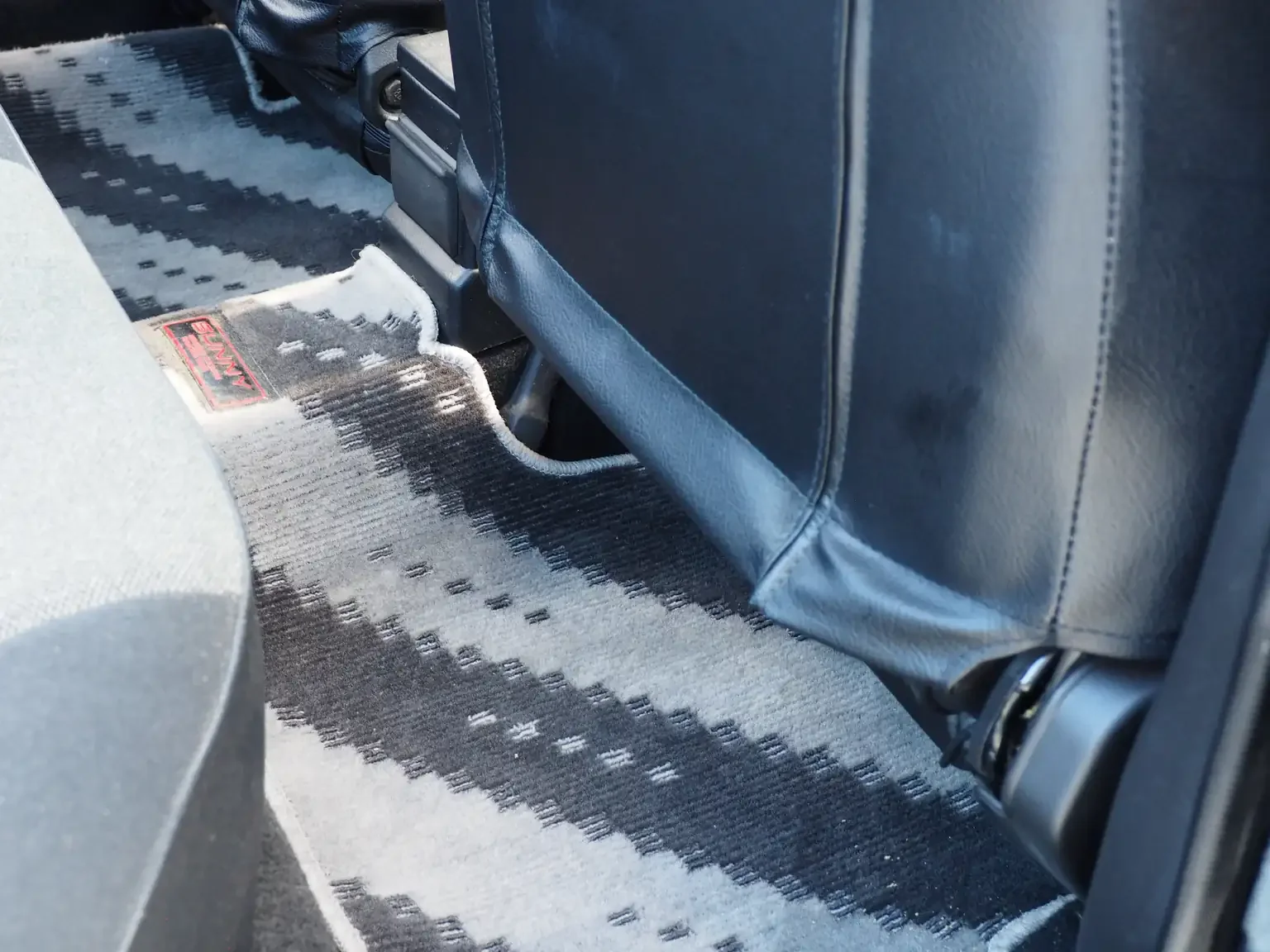 rear floor mat view of 1989 Nissan sunny super saloon twin cam NISMO in black jdm export vehicle Japan