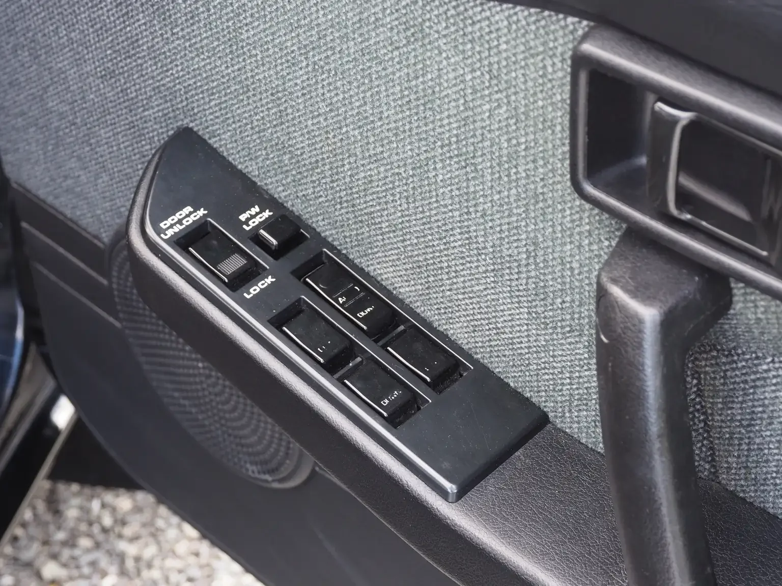 drivers master switch panel view of 1989 Nissan sunny super saloon twin cam NISMO in black jdm export vehicle Japan