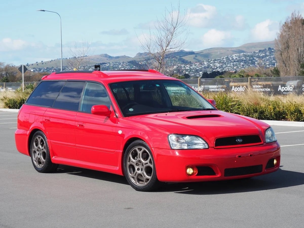 front drivers side angle view red subaru legacy blitzes 2002 JDM for sale export vehicle New Zealand