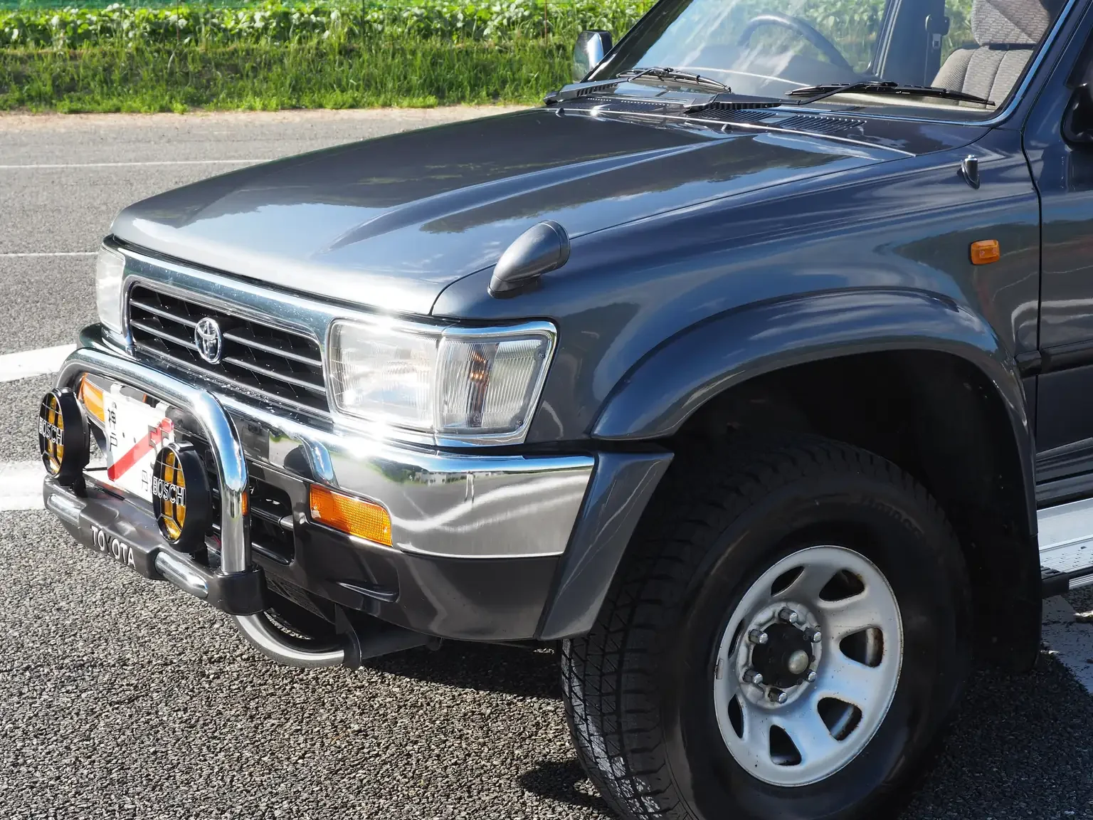 front end side angle view grey toyota hilux surf kzn130 1kzte 5 speed manual diesel turbo JDM export vehicle Japan