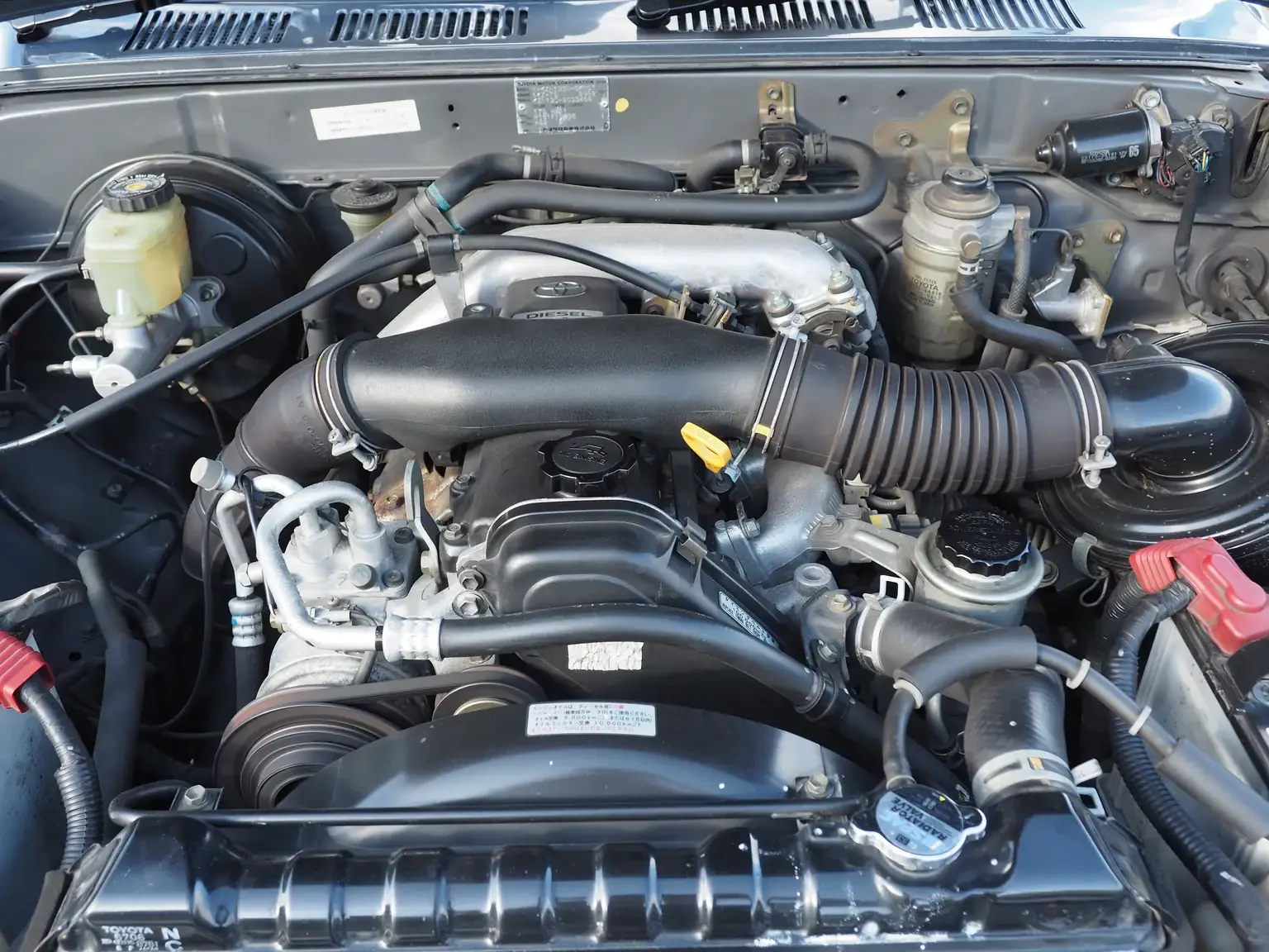 engine view view grey toyota hilux surf kzn130 1kzte 5 speed manual diesel turbo JDM export vehicle Japan