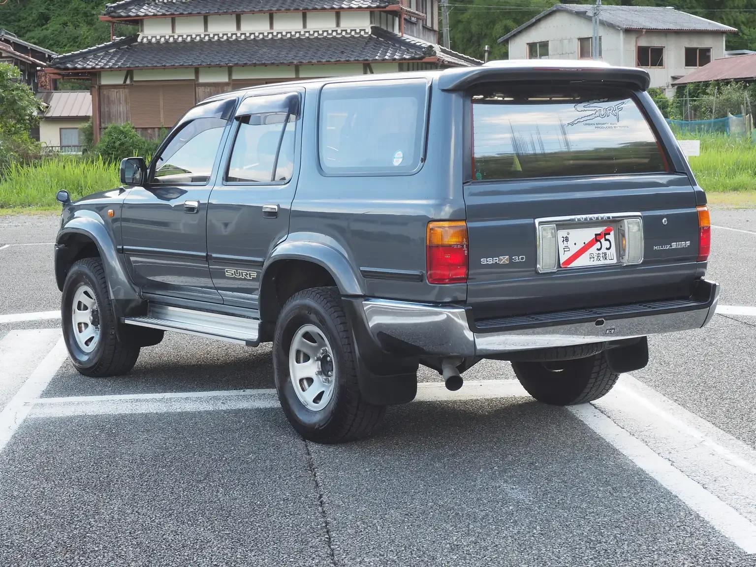 rear passengers angle view view grey toyota hilux surf kzn130 1kzte 5 speed manual diesel turbo JDM export vehicle Japan