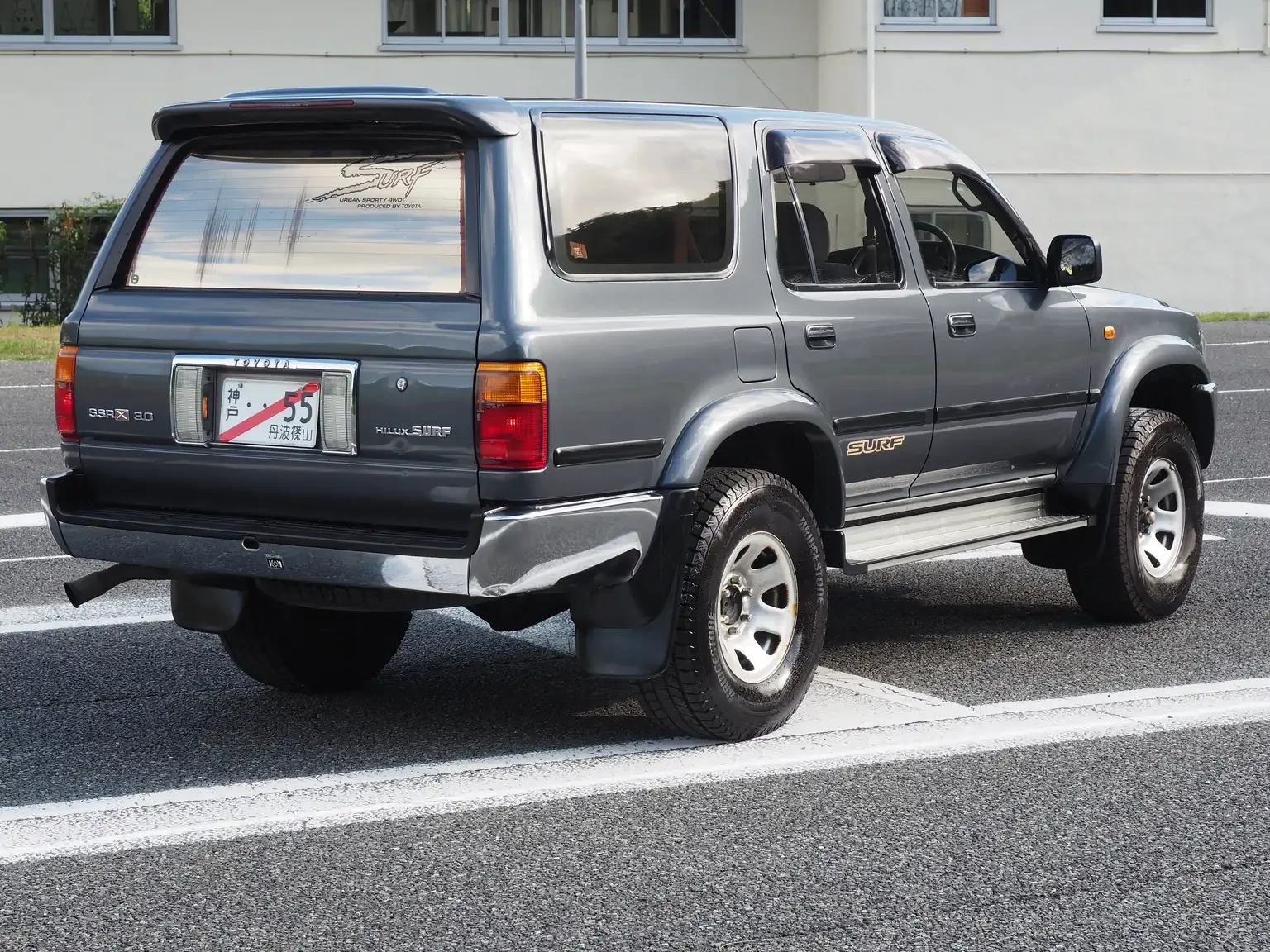 rear drivers side angle view grey toyota hilux surf kzn130 1kzte 5 speed manual diesel turbo JDM export vehicle Japan