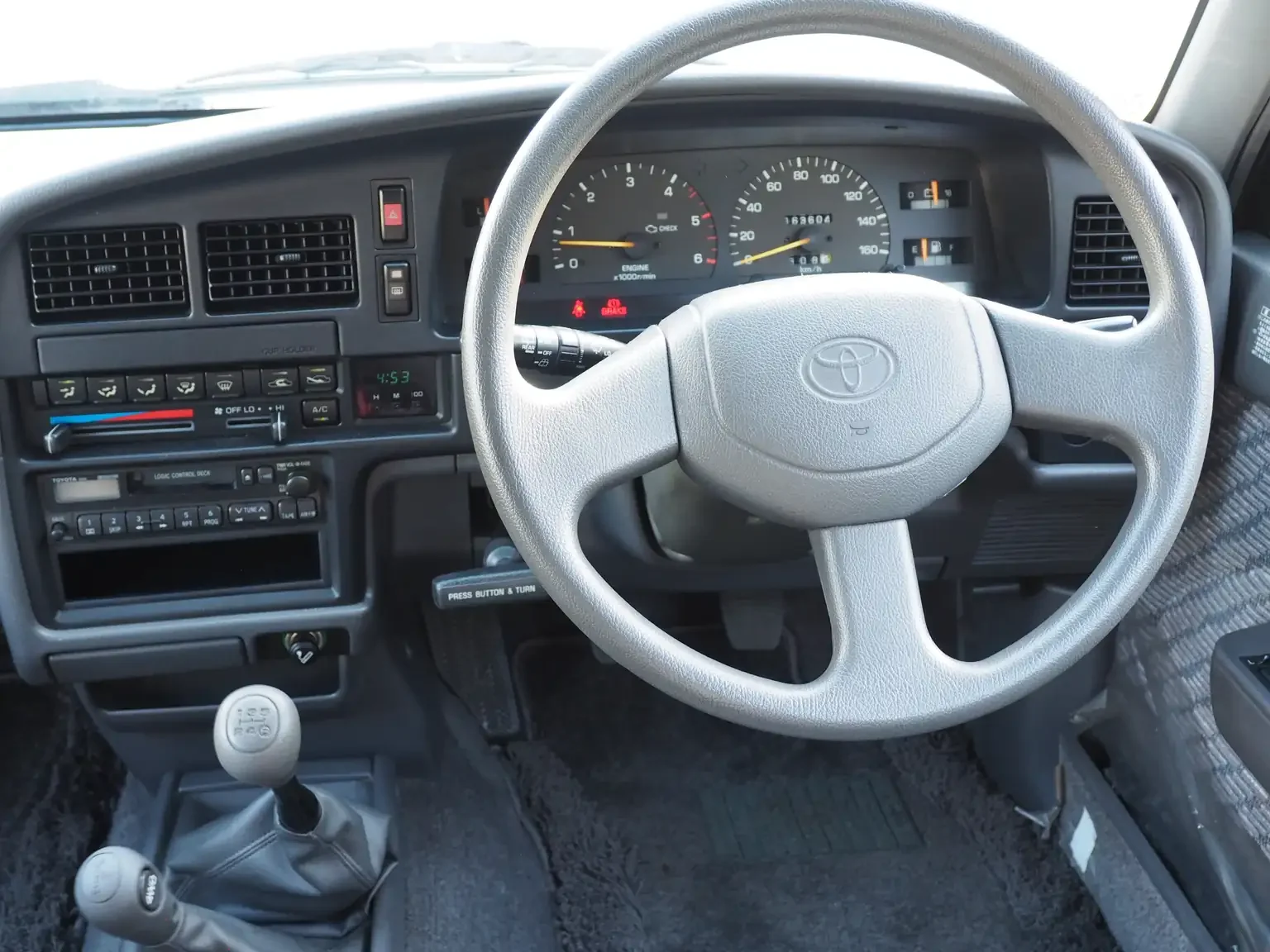 drivers cockpit view grey toyota hilux surf kzn130 1kzte 5 speed manual diesel turbo JDM export vehicle Japan