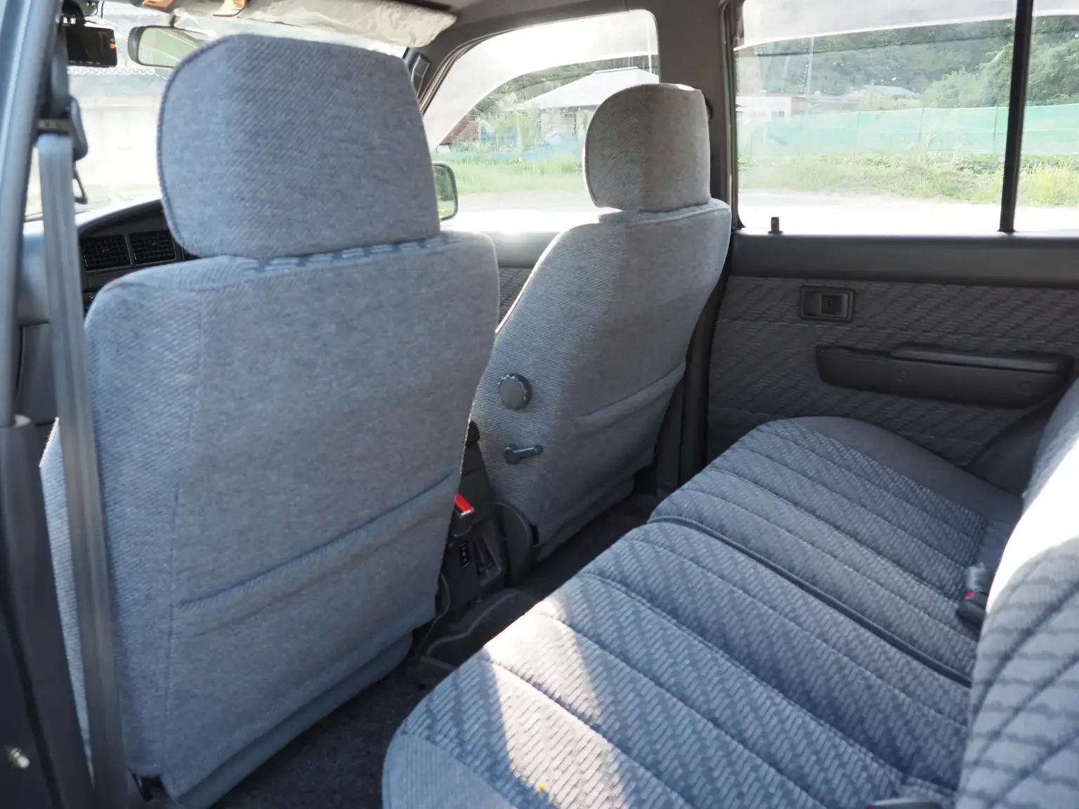 front seat back interior view grey toyota hilux surf kzn130 1kzte 5 speed manual diesel turbo JDM export vehicle Japan