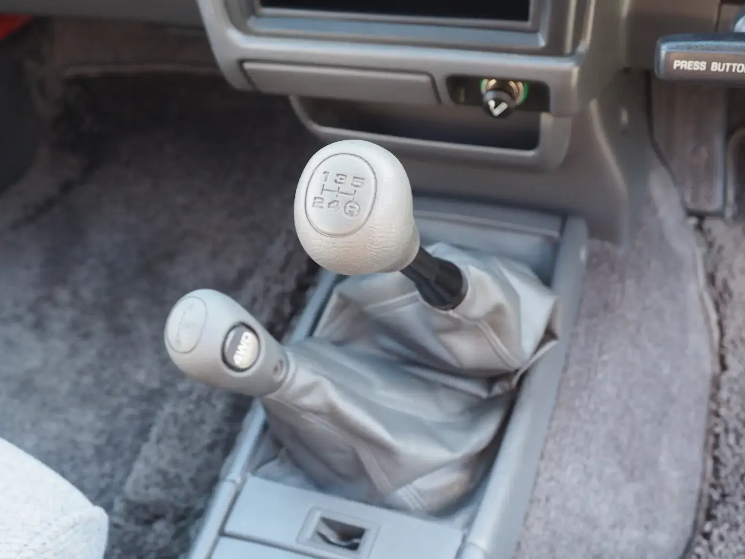 manual shifter view grey toyota hilux surf kzn130 1kzte 5 speed manual diesel turbo JDM export vehicle Japan