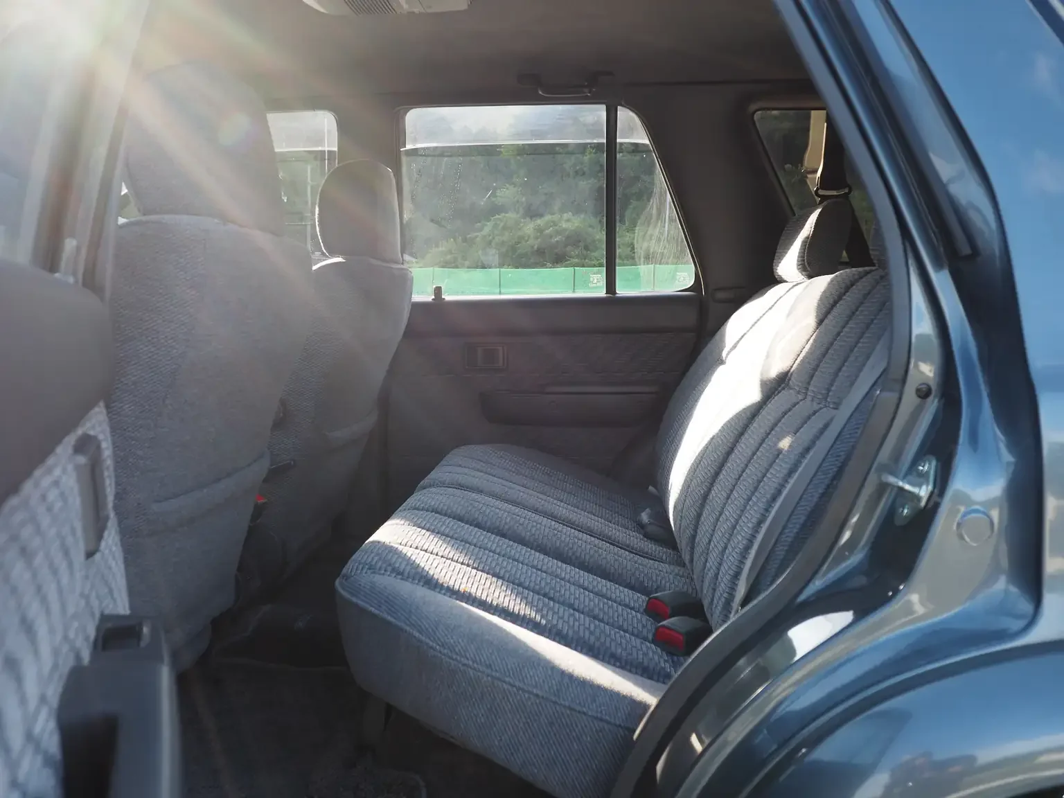 rear passengers seat view grey toyota hilux surf kzn130 1kzte 5 speed manual diesel turbo JDM export vehicle Japan