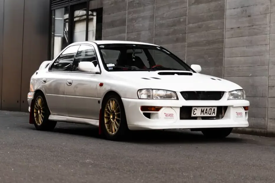 front angle view white subaru wrx sti version for jdm export vehicle New Zealand