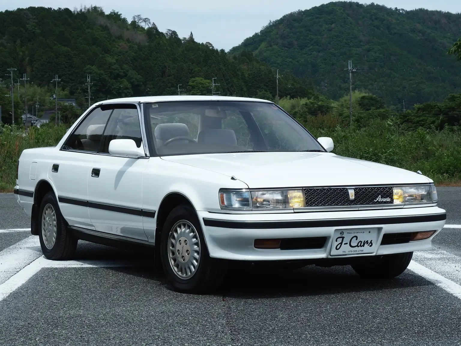 Front angle view Toyota Chaser Avante white 5 speed manual JDM export inventory Japan