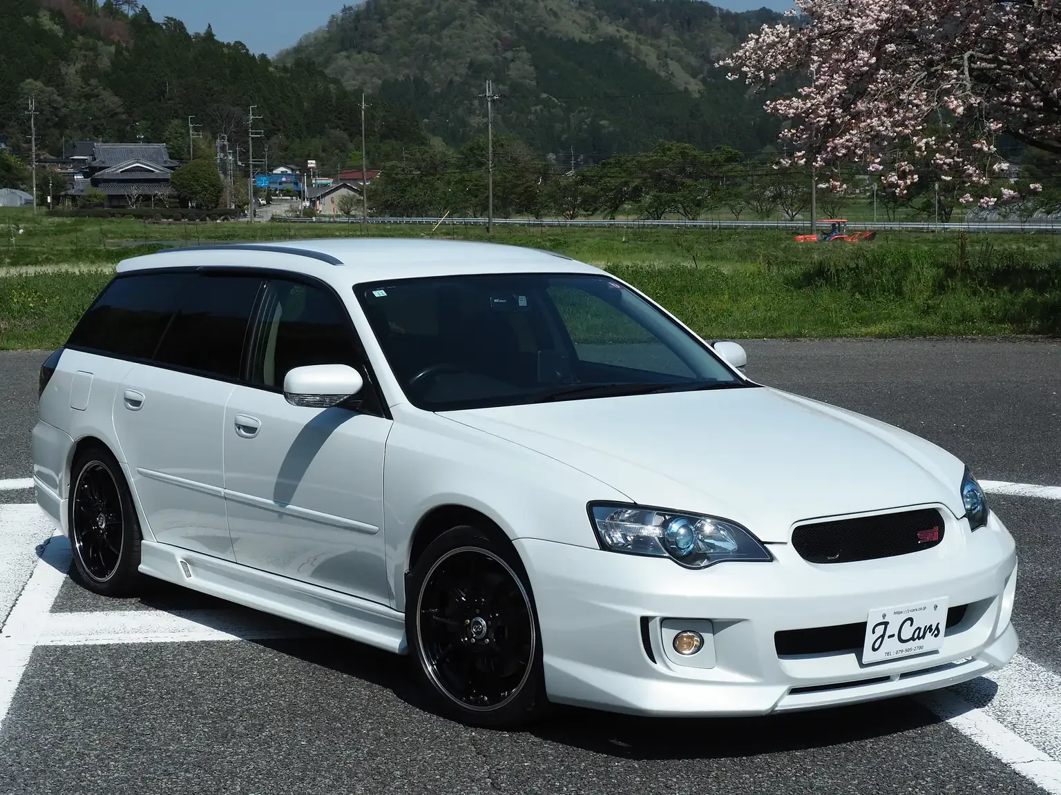 front drivers side angle view pearl 2005 subaru legacy 3.0r b-spec sti 6 speed manual transmission jdm export vehicle for sale Japan