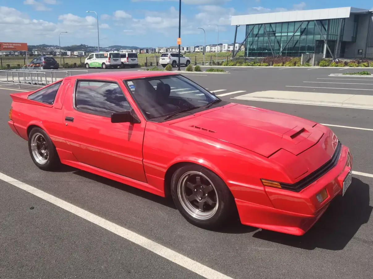 Front drivers side view of red Mitsubishi Starion GSR II Turbo JDM Export Vehicle for sale in New Zealand