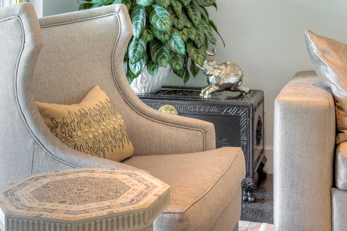 wingback-chair-custom-gray-fabric-beaded-pillows-moraccan-style-sidetable.jpg