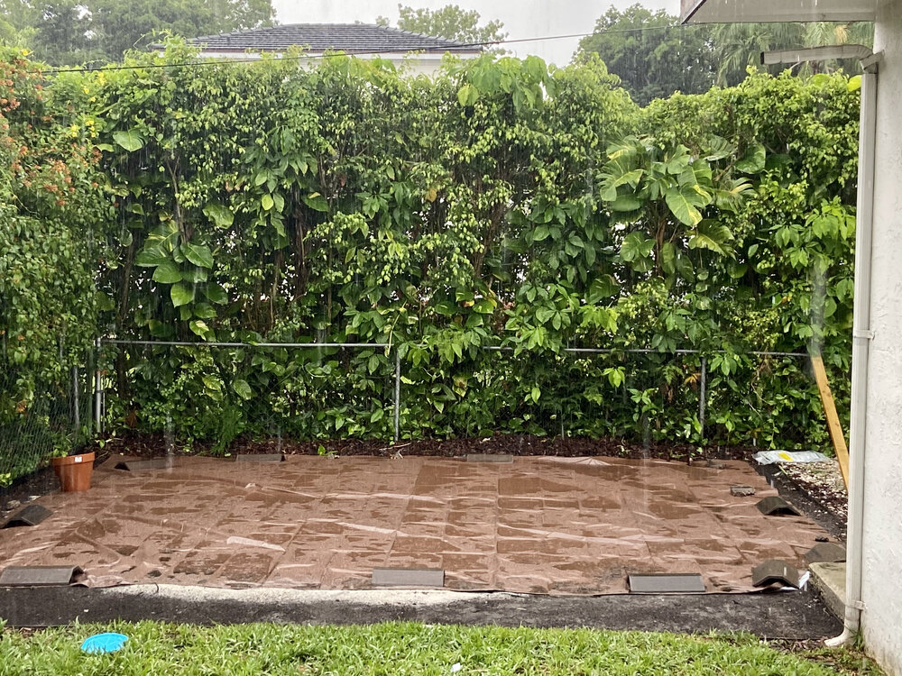 Installing a heavy duty tarp for extra protection below our above ground pool