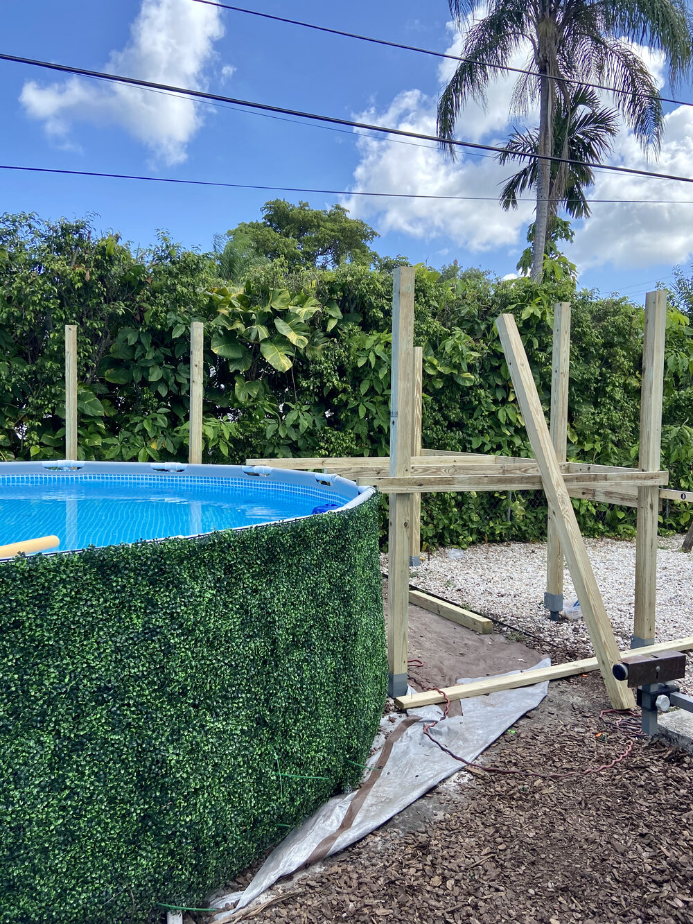 Setting up the frame for our above ground pool semi-deck