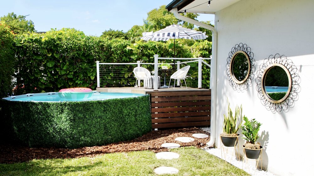 Can a small backyard look styling with  an above-ground pool and deck? Yes it can!