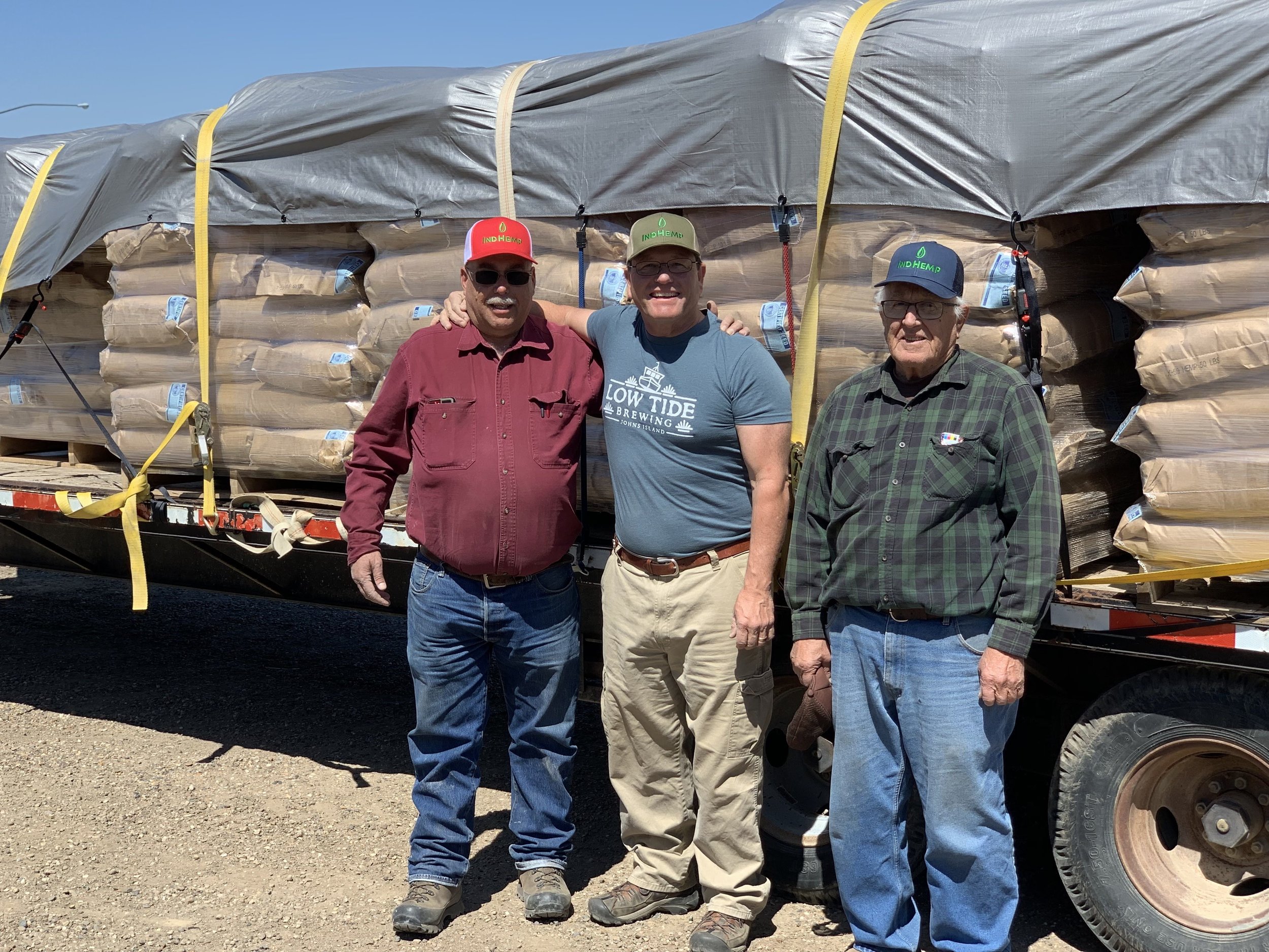 Ken loading up local organic farmer Dan French with friend Norm