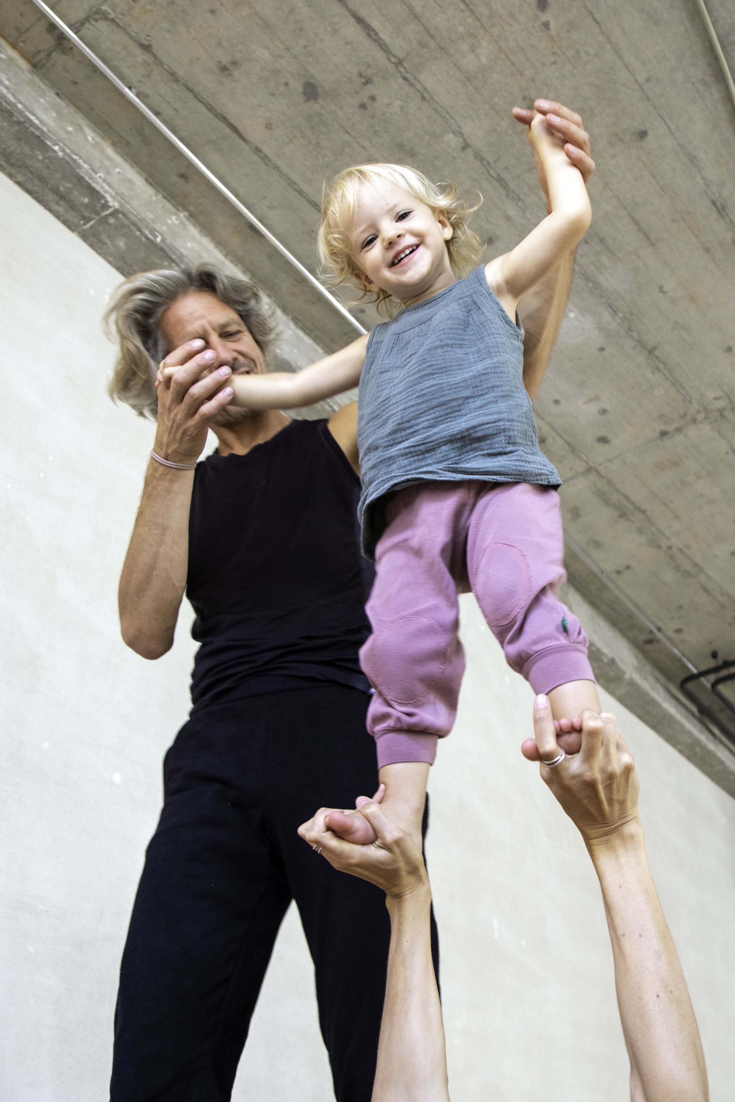 Father and Daughter practice Family Yoga at YOGABLOOM in Basel, Switzerland