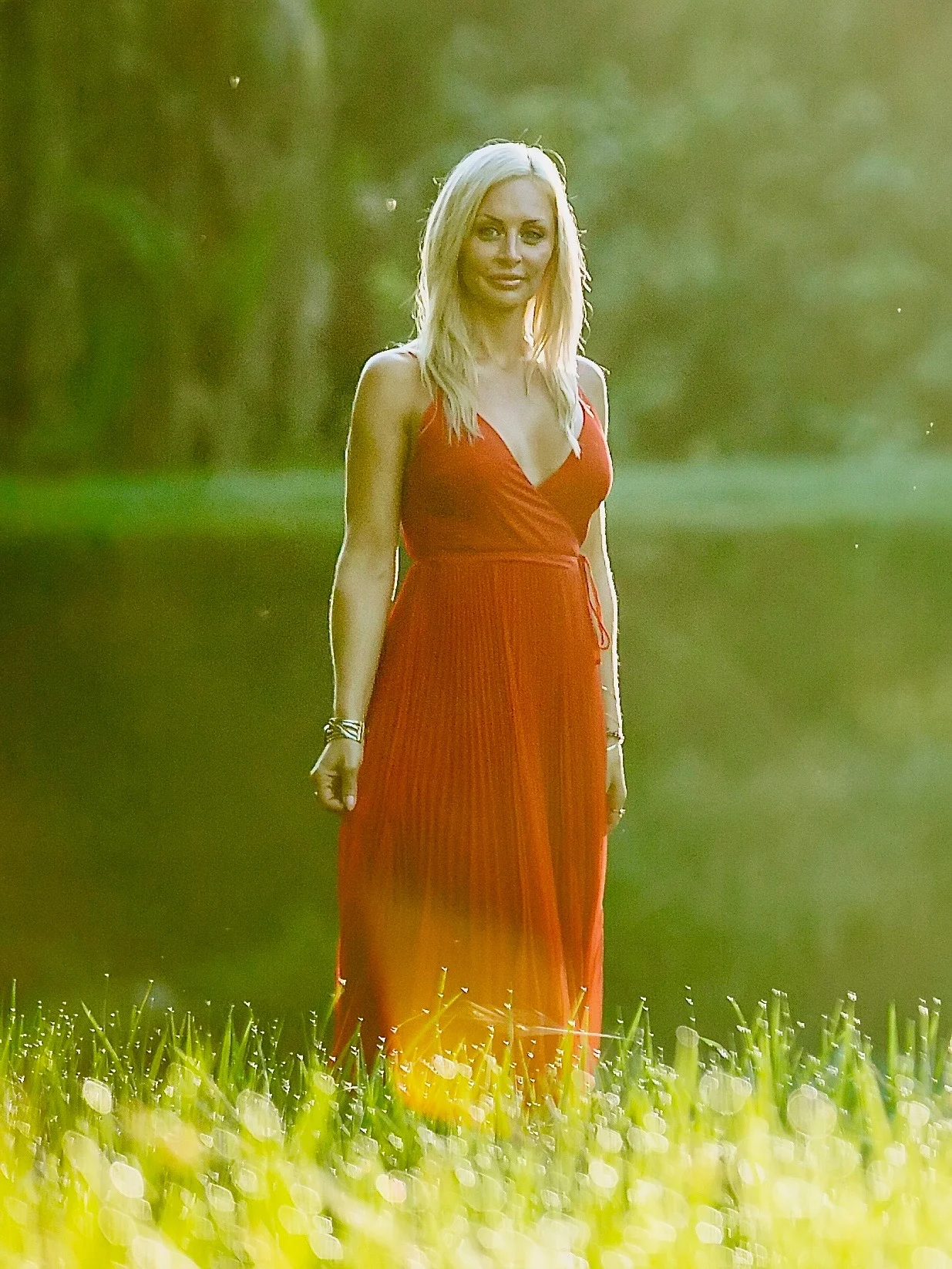 Linsey Bell, Registered Psychotherapist (CRPO) and founder of Lotus Soul Therapy, standing in a rice field.
