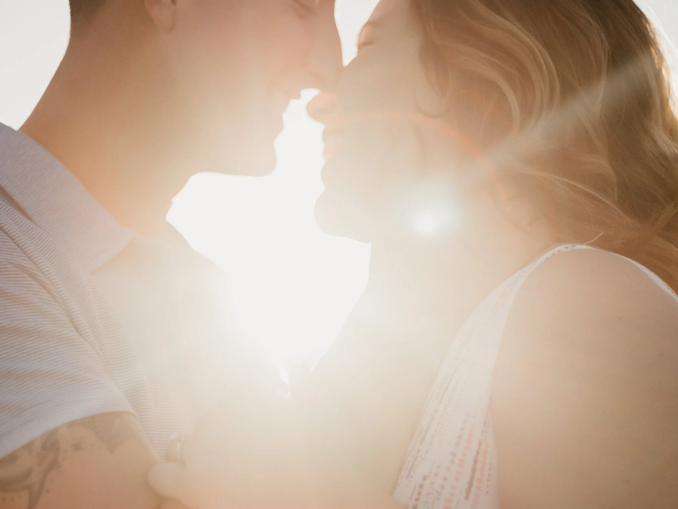 Couple embracing at sunset representing couples and relationship therapy, emotional connection, and Emotionally Focused Therapy (EFT) in Toronto and online across Ontario.