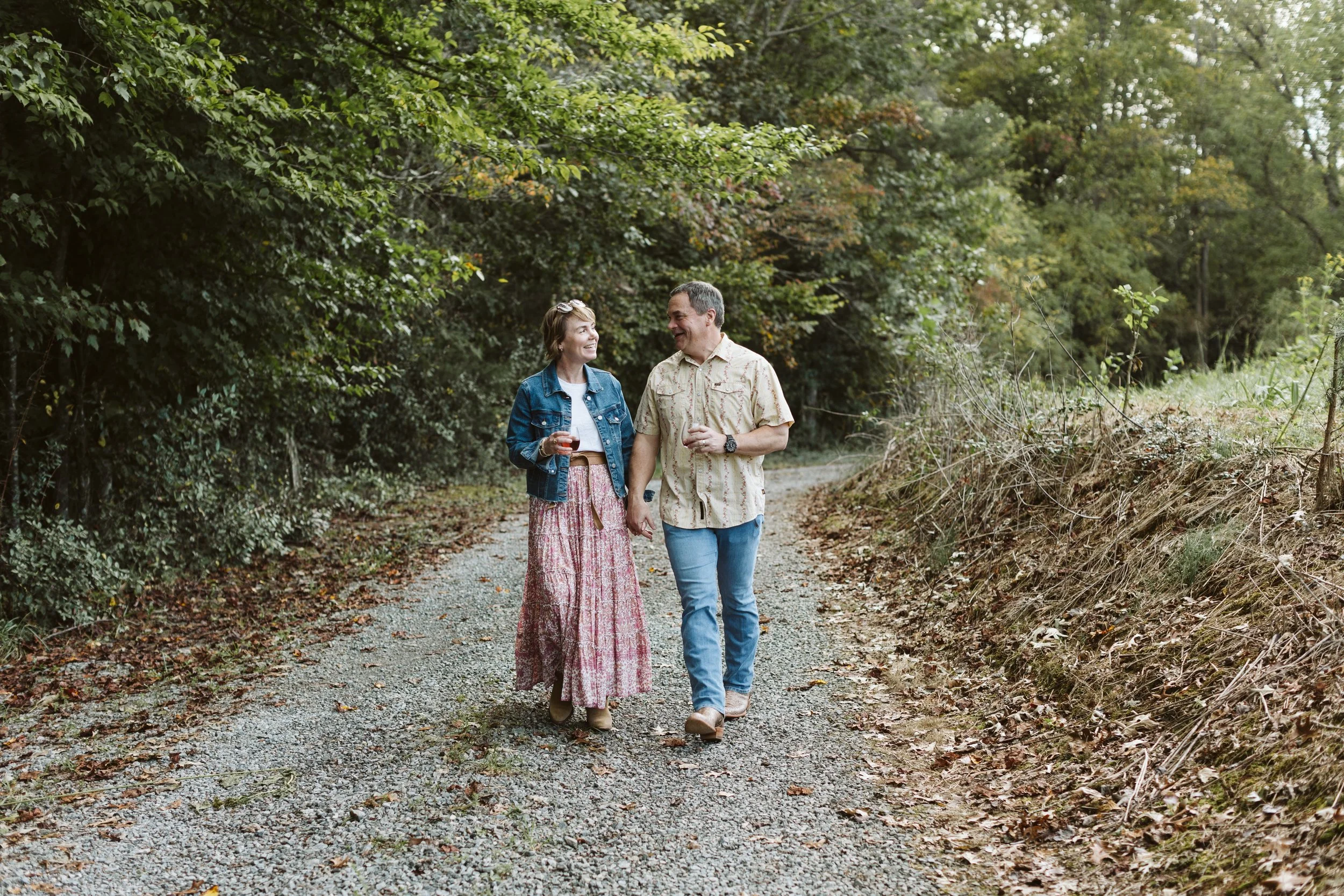 couple walking along a gravel trail