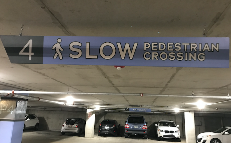 Showdog provided turnkey environmental graphics and signage for the parking garage at Vertis. These include project colors w/reflective copy, calling attention to heavy pedestrian areas.