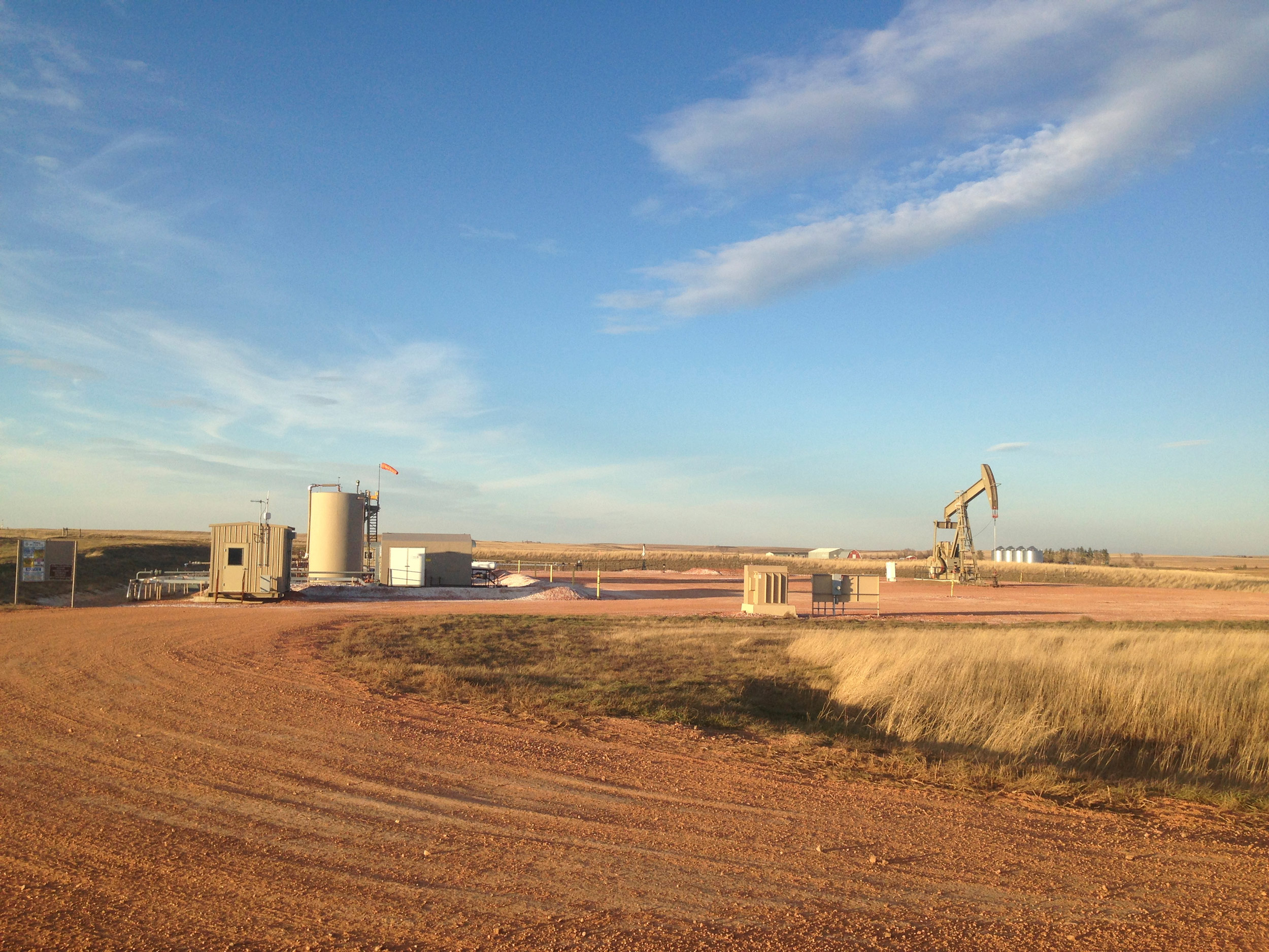 Oil and gas infrastructure at sunset, McKenzie County