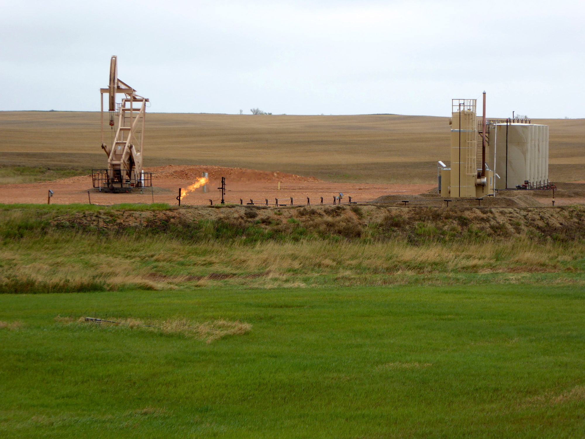 Excess natural gas is flared at a well pad in McKenzie County, ND