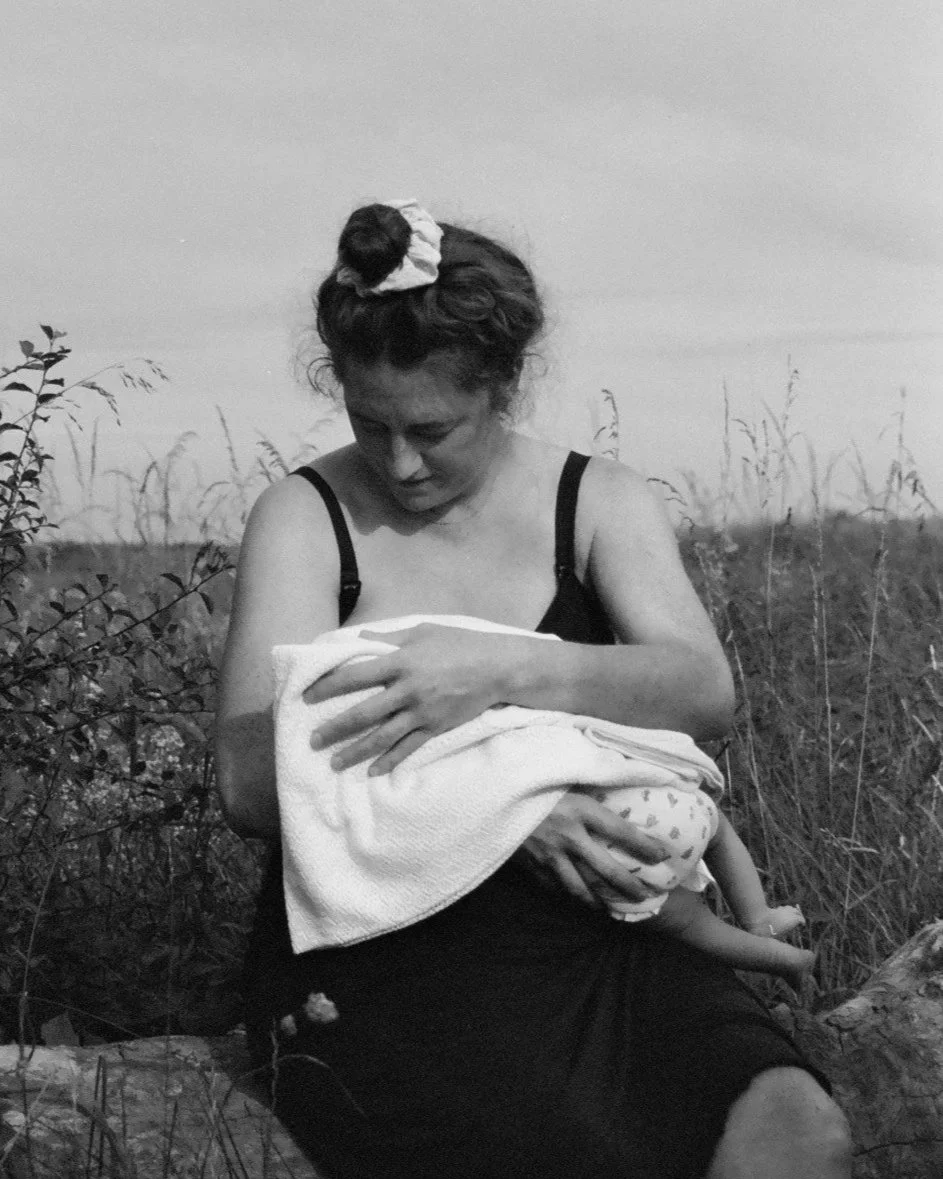 Yoga teacher Bex Gillam holding a baby
