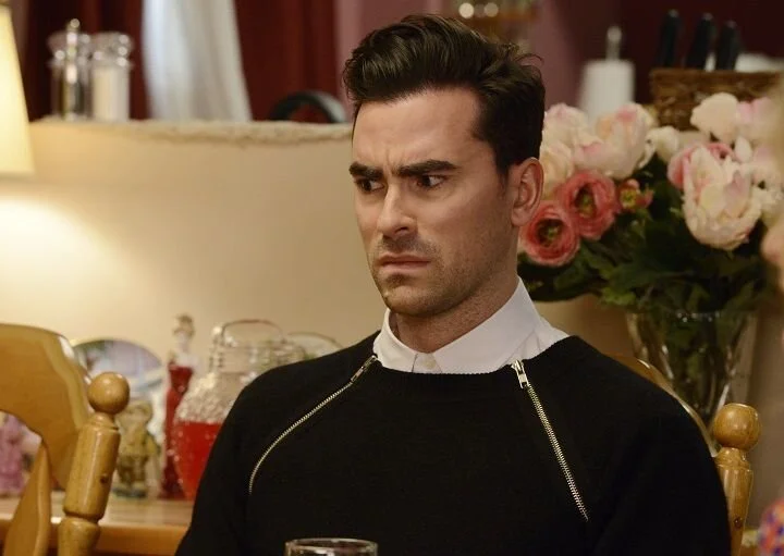 Chic layering and a scowl // Photo via PopTV