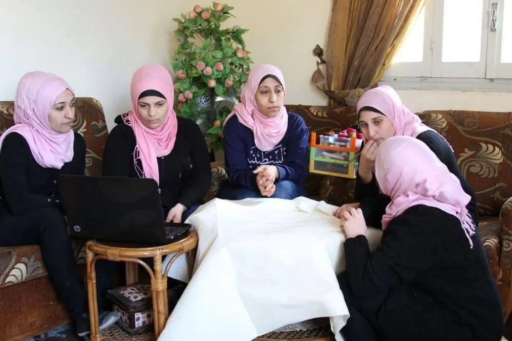 The sisters of 6 Flowers embroidering in the first half of 2023.