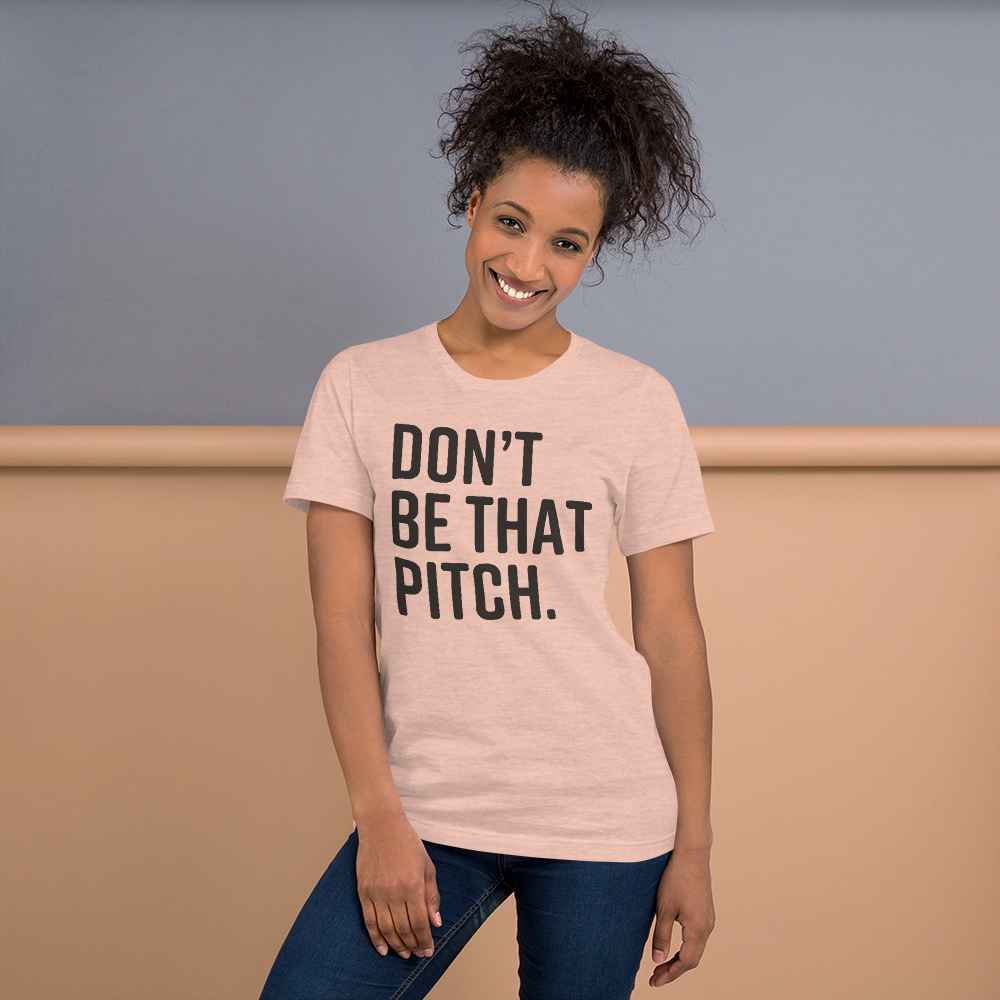 DONT-BE-THAT-PITCH1-brown_mockup_Front_Womens-Lifestyle_Heather-Prism-Peach.png