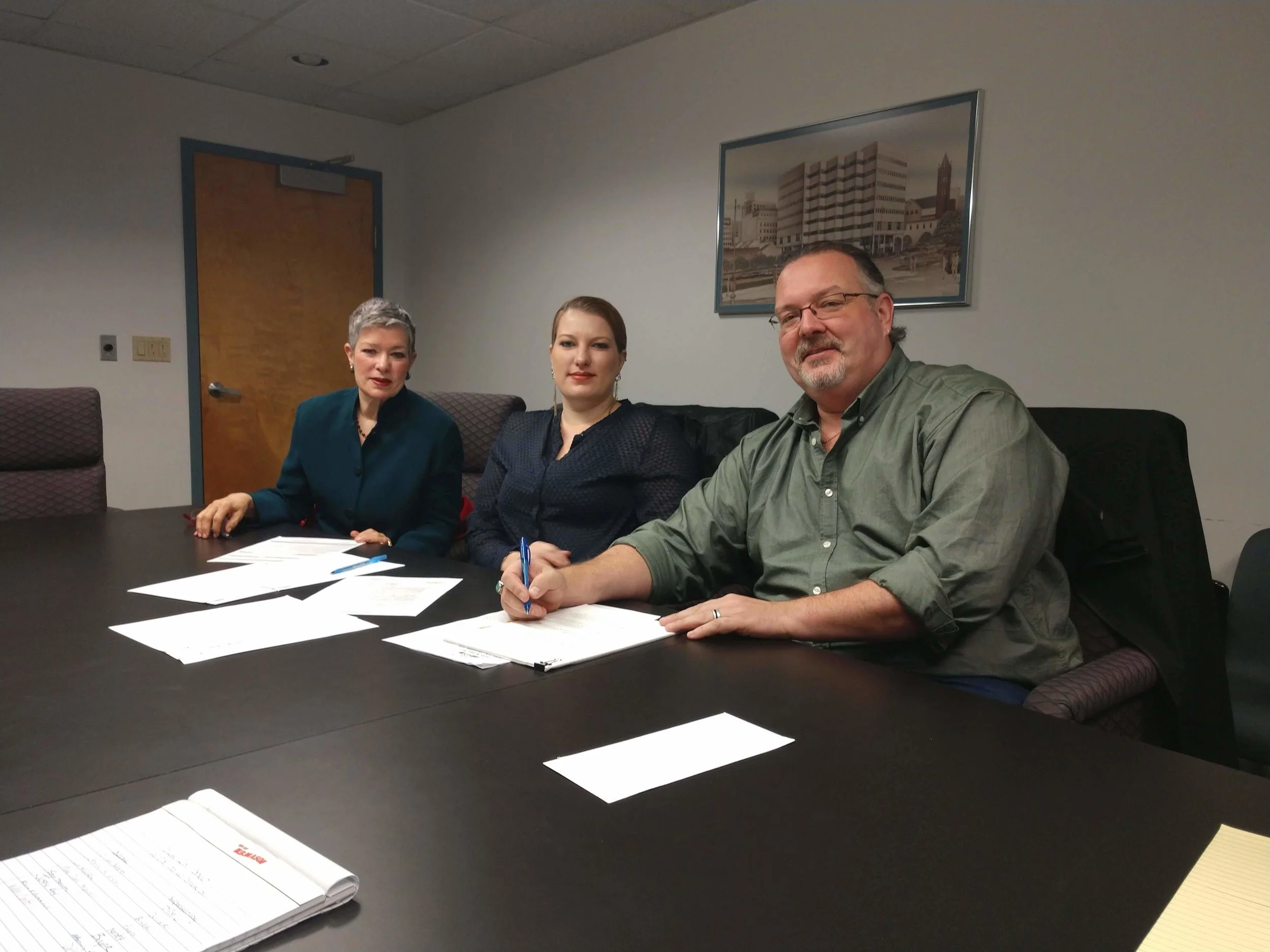 From left to right: Mary Jane, Lia & Jason happily signing the closing papers at the NJDPMC office in Trenton NJ 10/17/18.