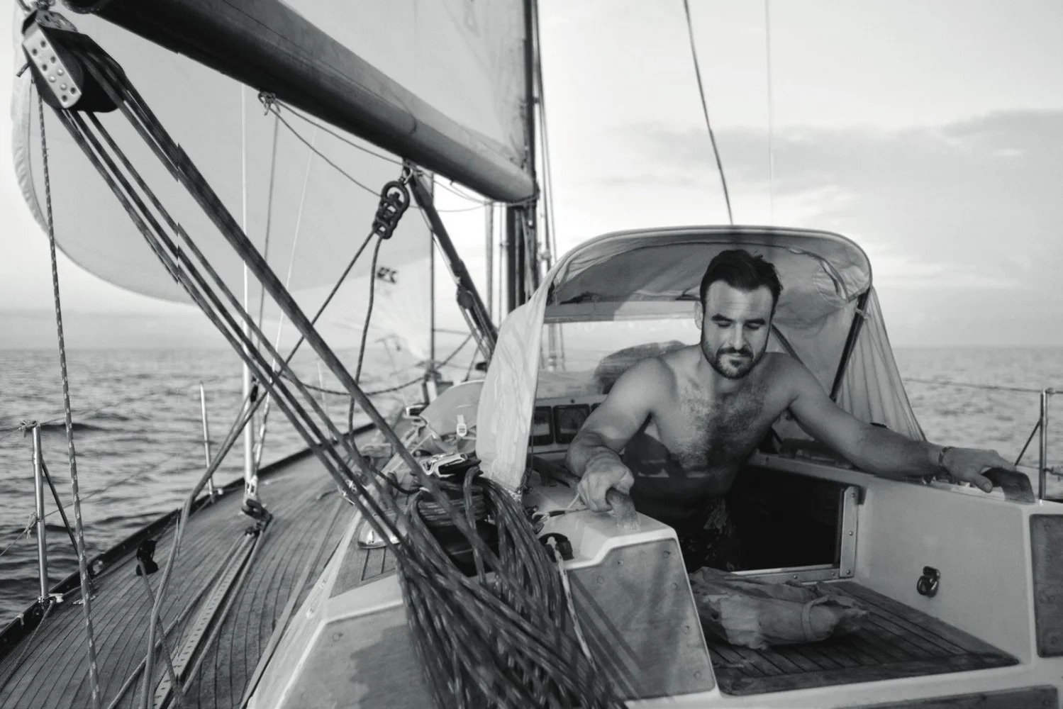 “Only assholes or admirals in the companionway” Julian checks the weather before his morning shift, off Martinique, 2012, photo by Max Imrie