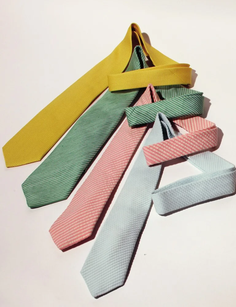 from top: silk twill tie HERMÈS wool and silk tie ISAIA seersucker cotton tie ALEXANDER OLCH