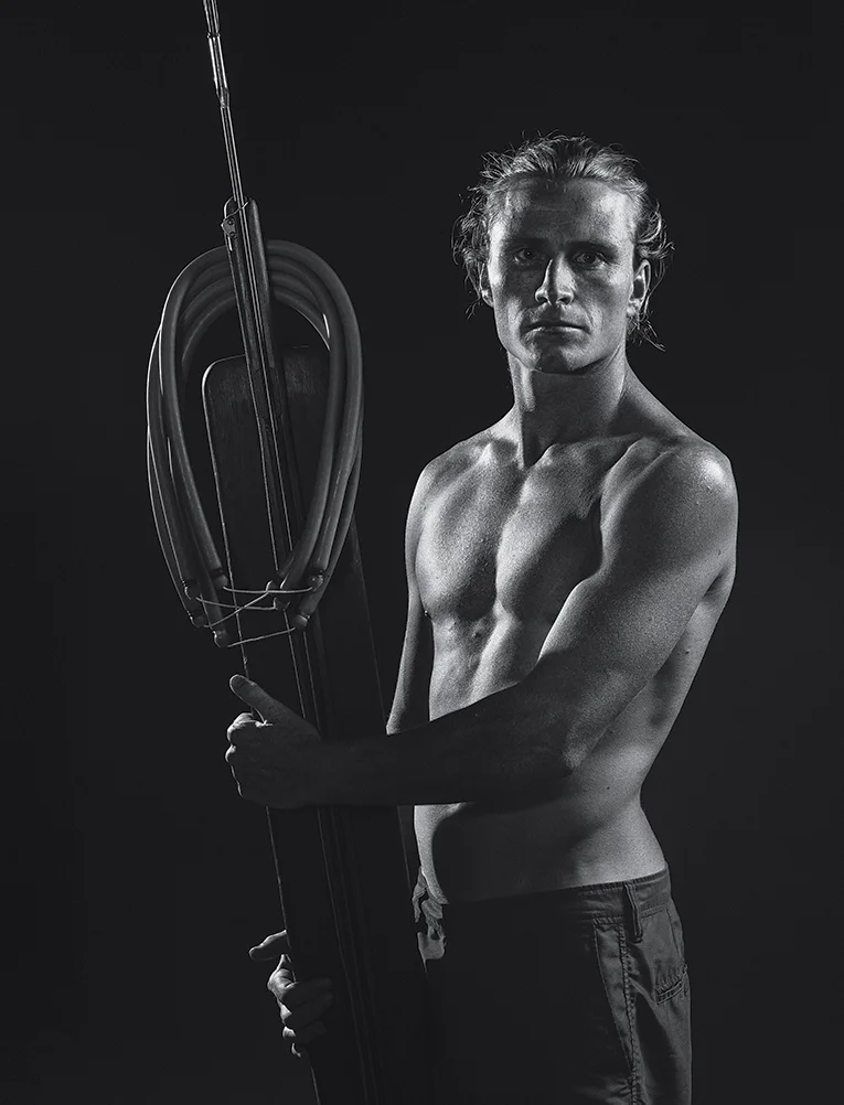 Healey and his trusty Riffe spear gun, 2015. Photograph by Jason Reposar