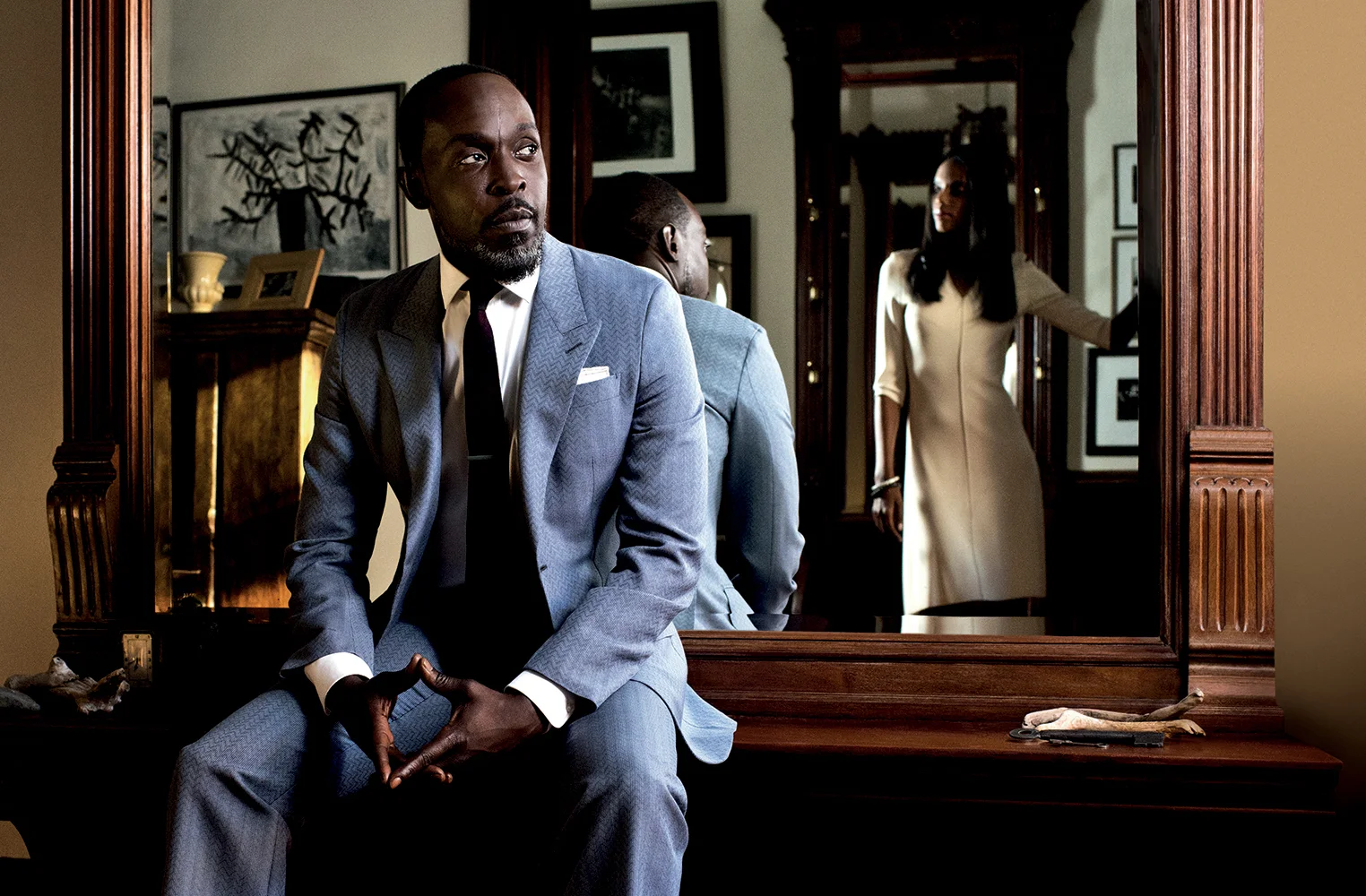 Slate gray peak lapel single-breasted suit LOUIS VUITTON white poplin dress shirt RALPH LAUREN burgundy and navy silk tie BURBERRY silver tie bar and white linen pocket square THE TIE BAR on her: cream quarter-sleeve dress CALVIN KLEIN silver chain cuffs PLUMA