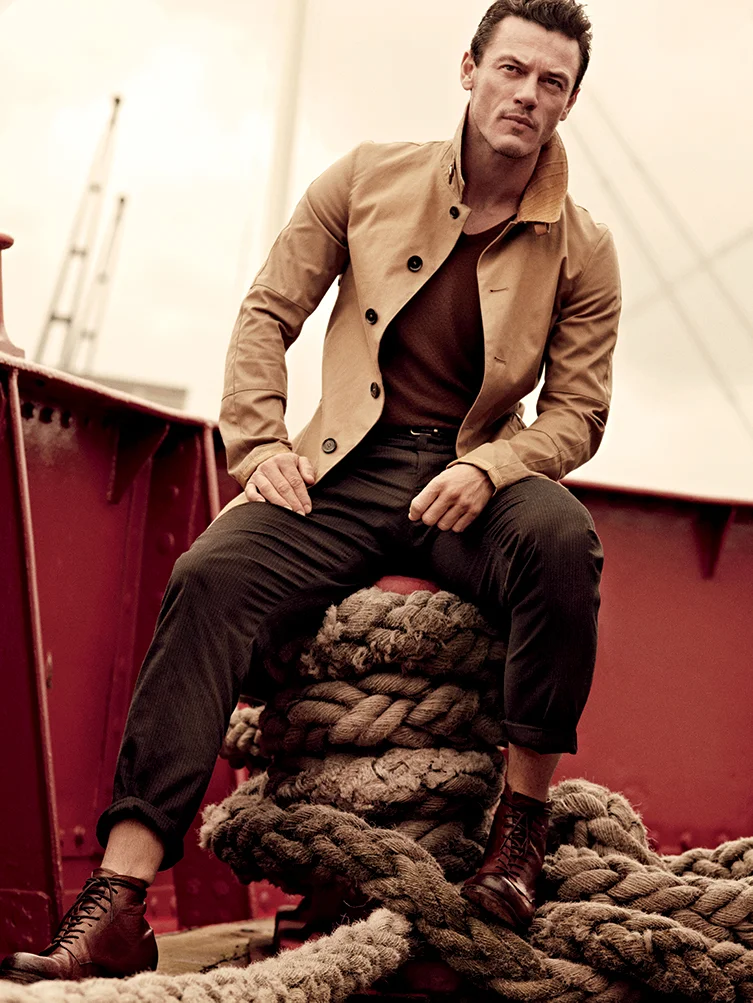 Canvas and leather coat Belstaff, Cashmere knit t-shirt Giorgio Armani, Wool pleated pants and calfskin belt Dolce & Gabbana, Calf boots Esquivel Shoes