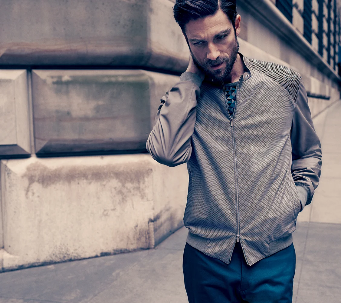 Perforated calfskin blouson jacket, fine wool pullover, thin cotton trousers